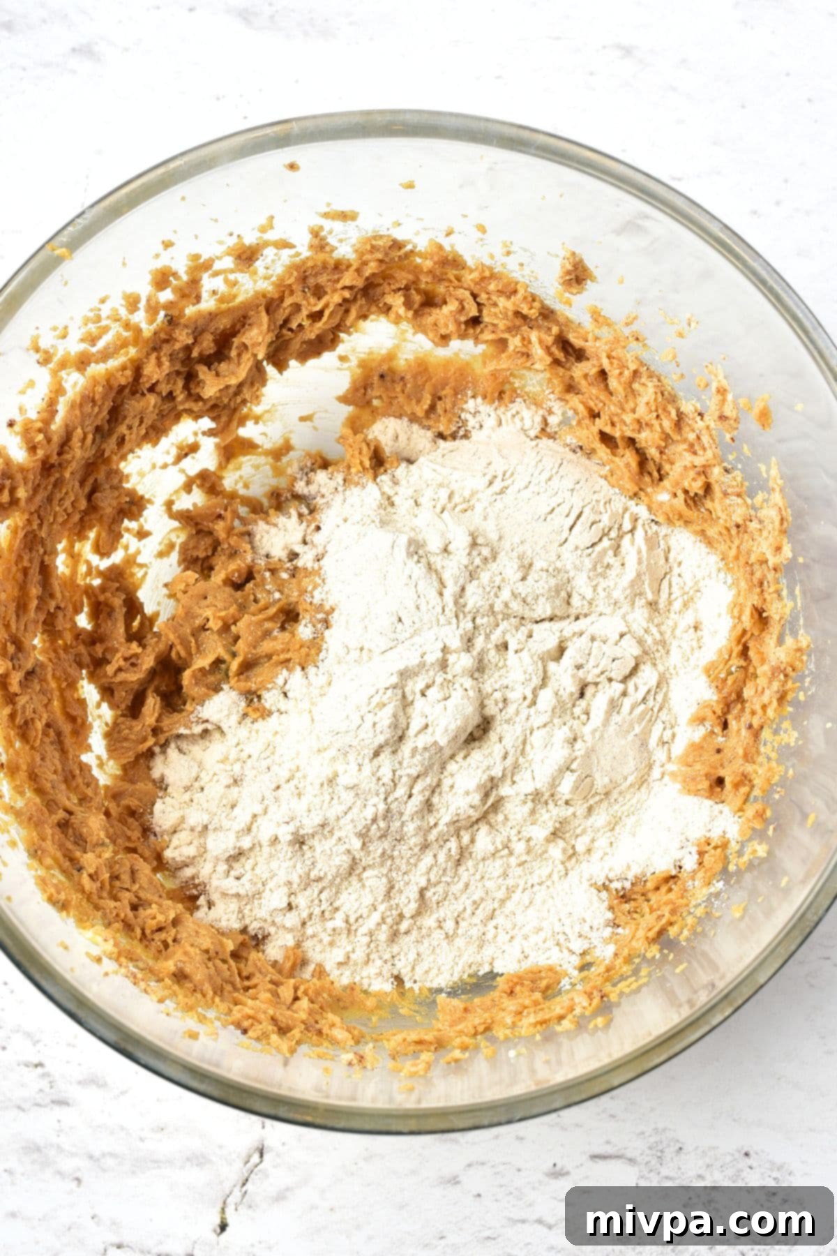 How to Make Gluten-Free Gingerbread Men Sifted flour mixture gently layered on top of the creamed butter-sugar mixture in a large bowl.