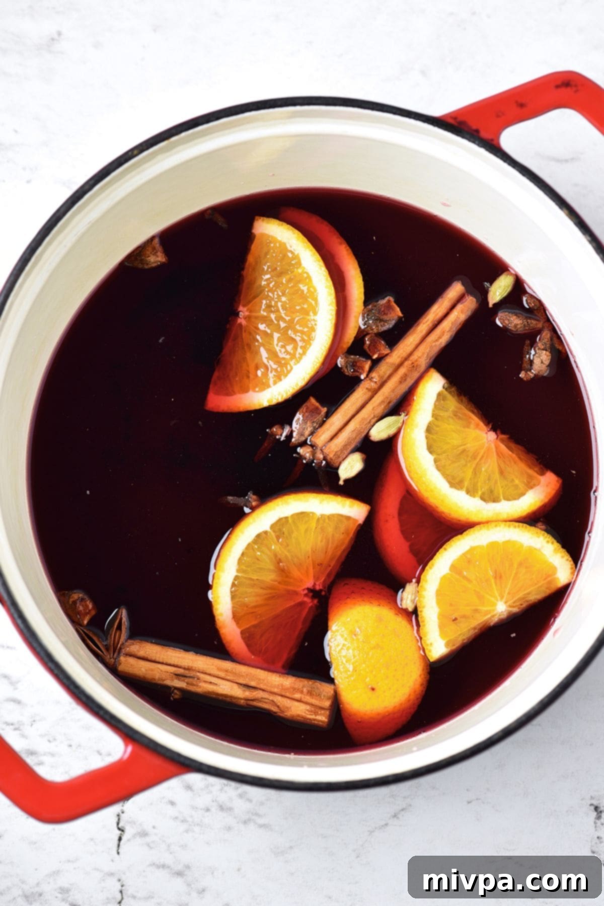 Simple Homemade Mulled Wine Gluten-Free and Vegan 6 Step 1: Red wine, orange slices, brown sugar, and whole spices are combined in a saucepan.