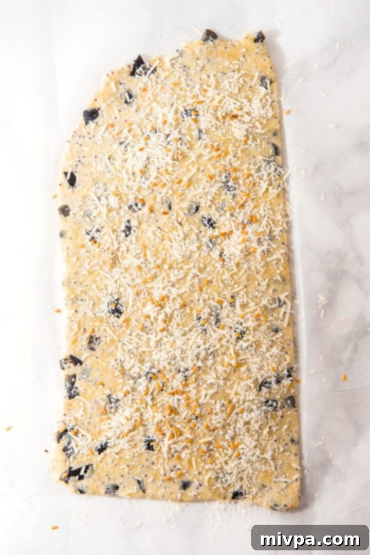 Savory Almond Flour Crackers Cracker dough sprinkled with cheese