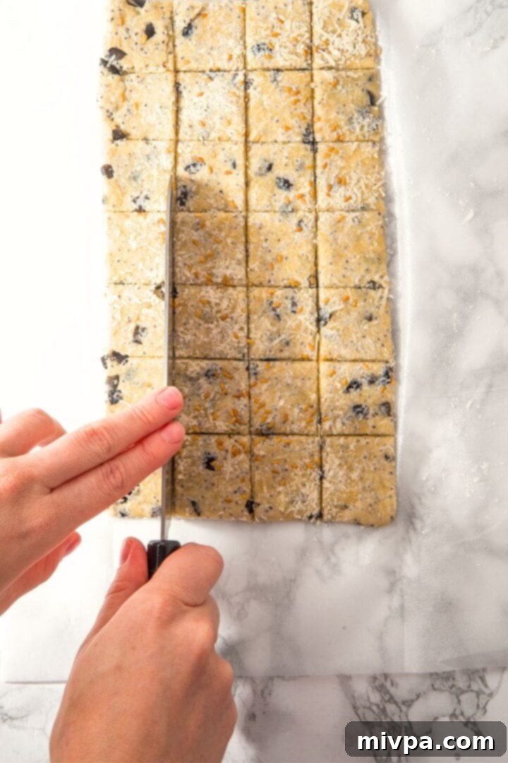 Savory Almond Flour Crackers Slicing cracker dough on parchment