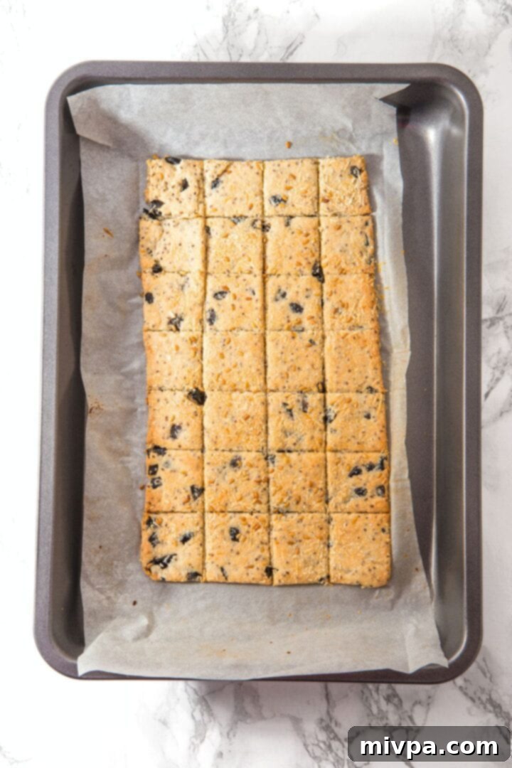 Almond Flour Cheese Crackers Freshly baked crackers on baking sheet