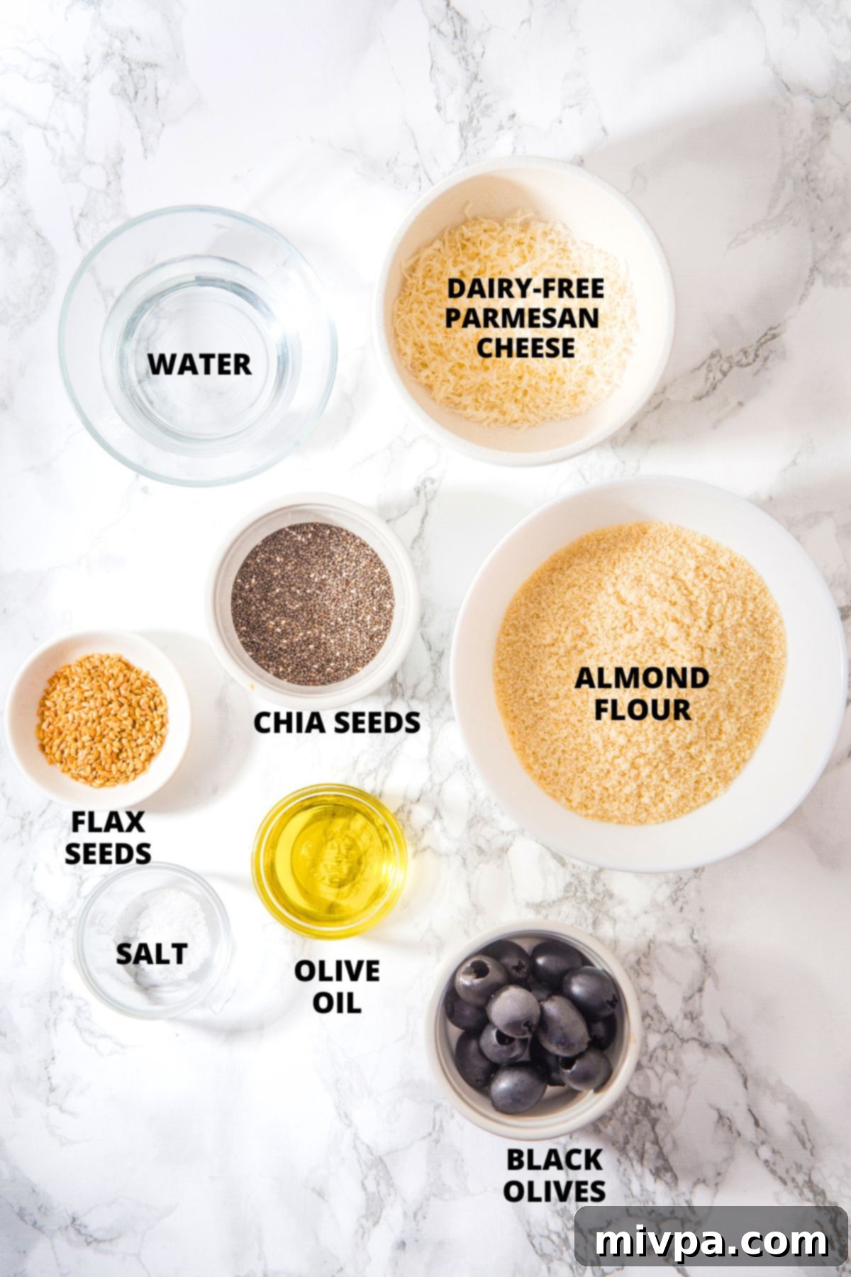 Almond Flour Crackers Recipe (Gluten-Free, Dairy-Free) Ingredients for almond flour crackers recipe laid out on marble board