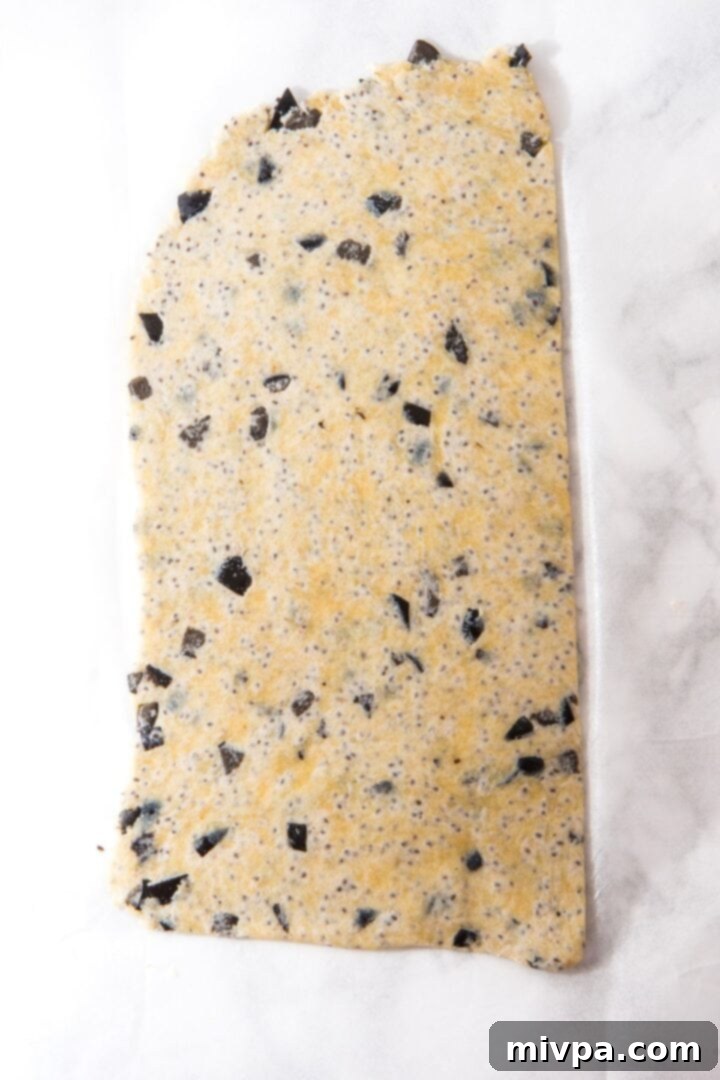 How to Make Almond Flour Crackers Rolled out cracker dough on parchment