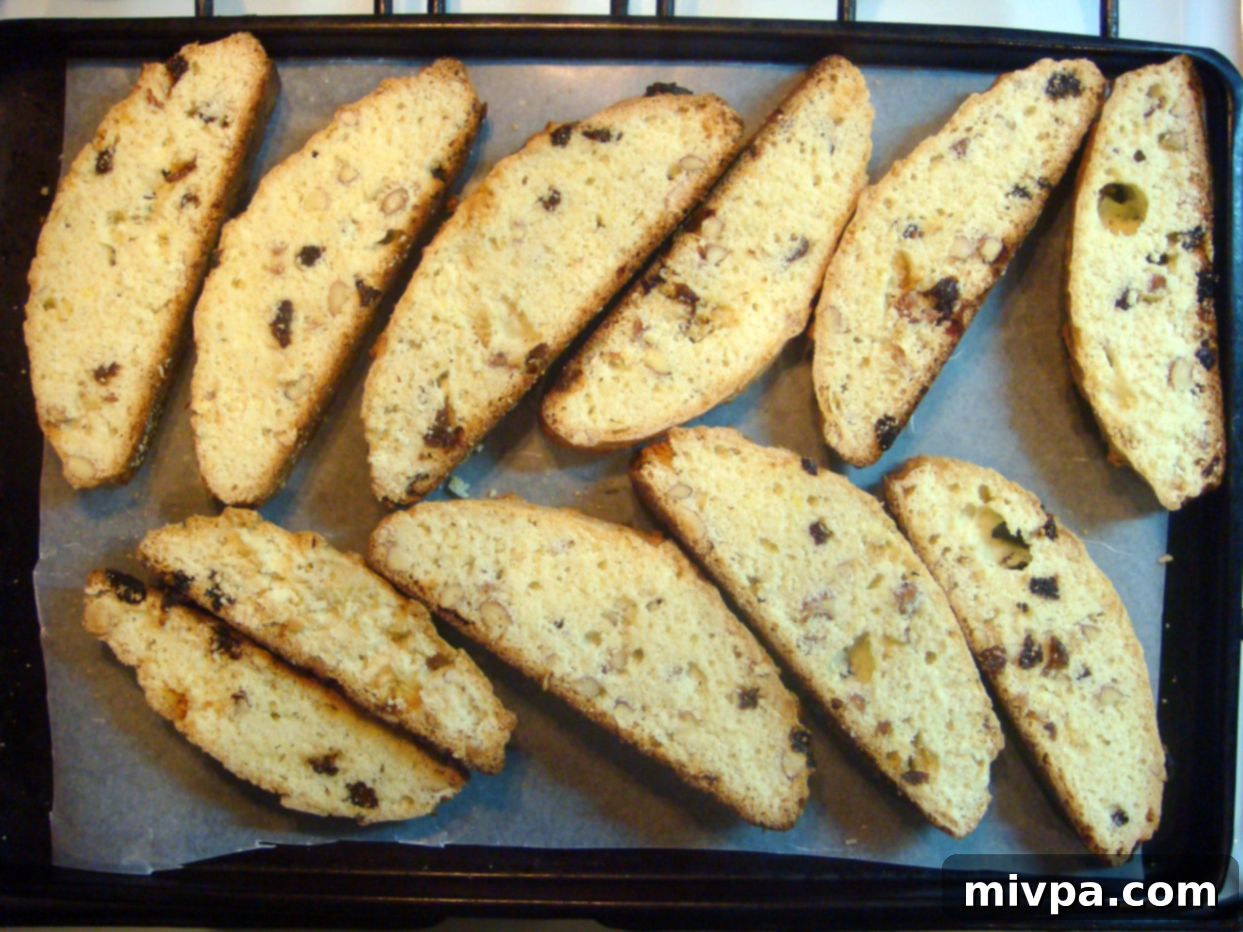 Zesty Lemon Almond Raisin Biscotti 16 The sliced biscotti pieces arranged on a baking sheet, ready to go back into the oven for their crucial second bake to achieve ultimate crunchiness.