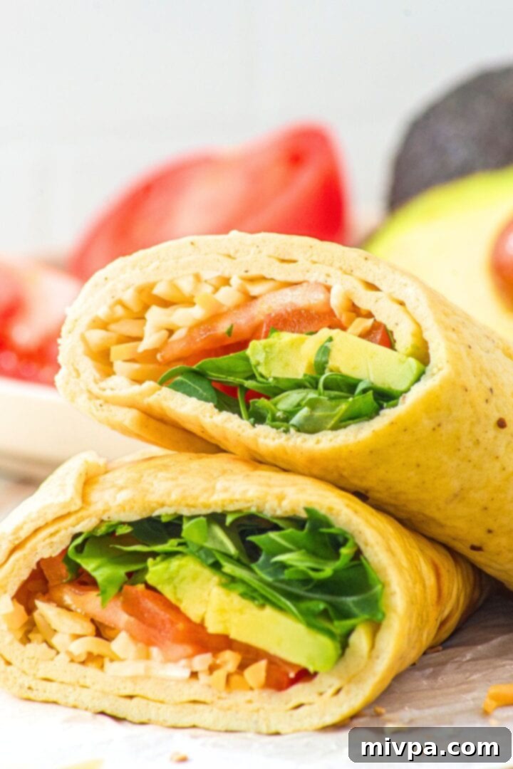 Cottage Cheese and Egg Flatbread Wrap Up close shot of sliced cottage cheese and egg flatbread wrap.