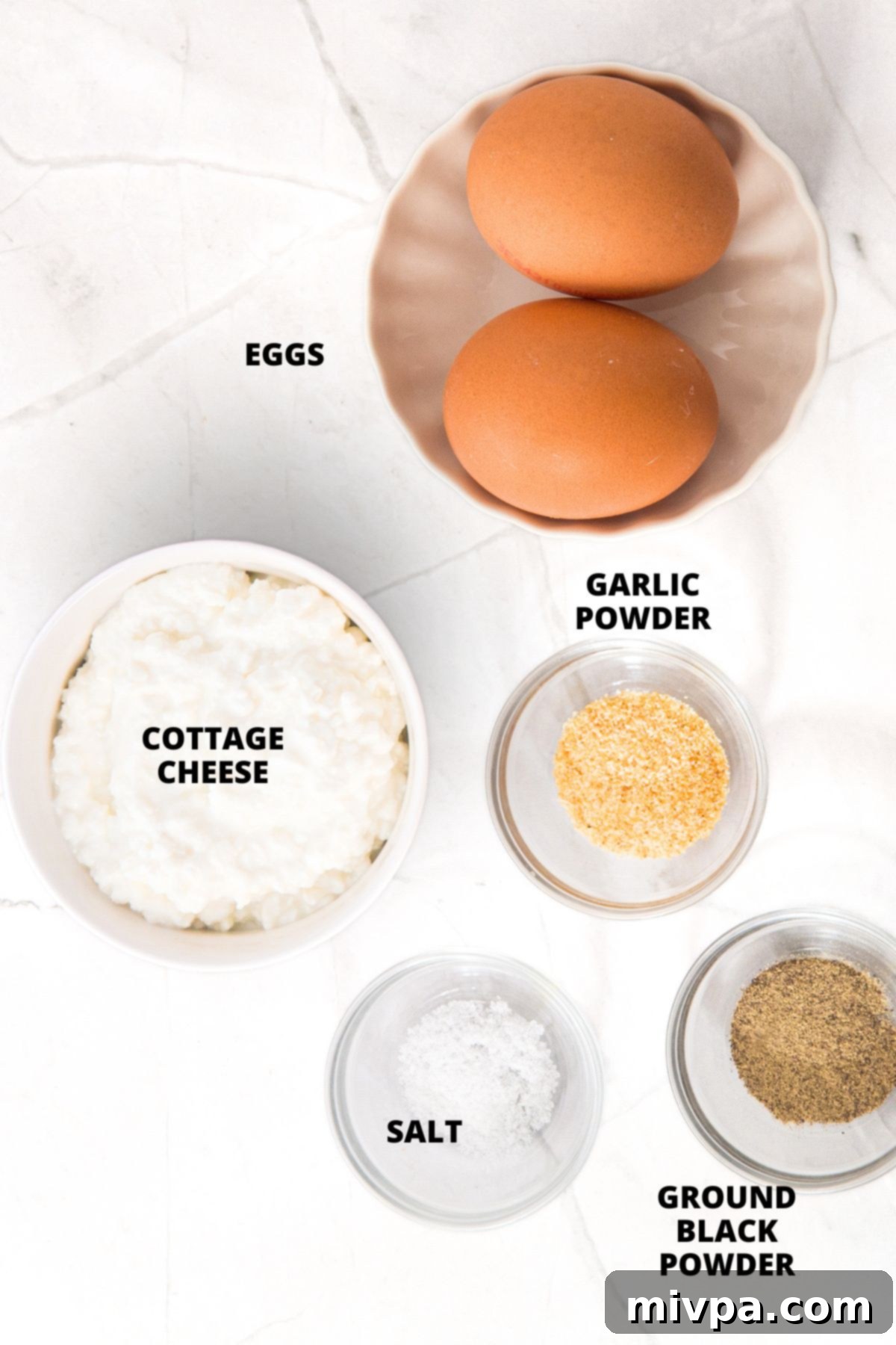 Cottage Cheese Flatbread Recipe (Gluten-Free, Low-Carb) Ingredients for cottage cheese flatbread recipe laid out on marble board.