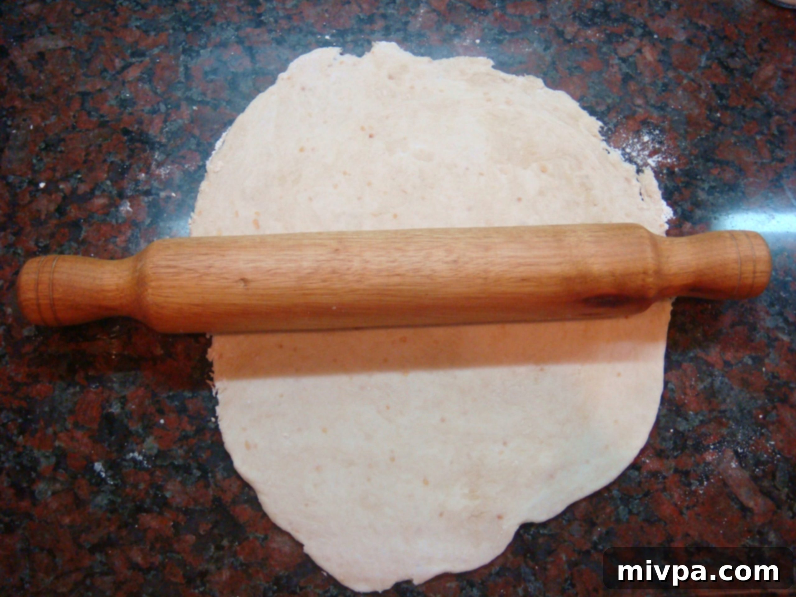 DSC07023 - Flattening cracker dough with a rolling pin