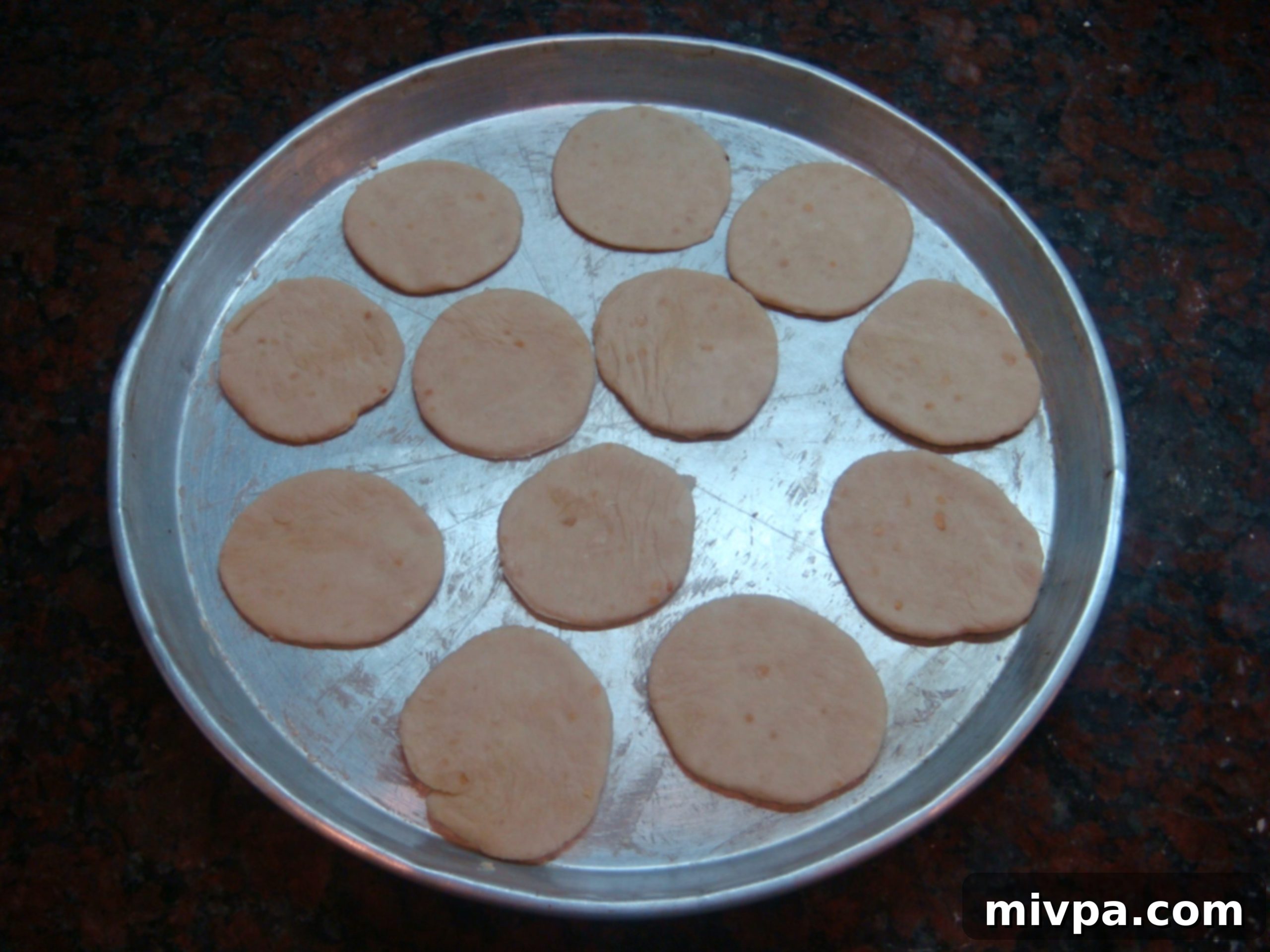 DSC07026 - Arranging cracker cut-outs on a greased baking tray