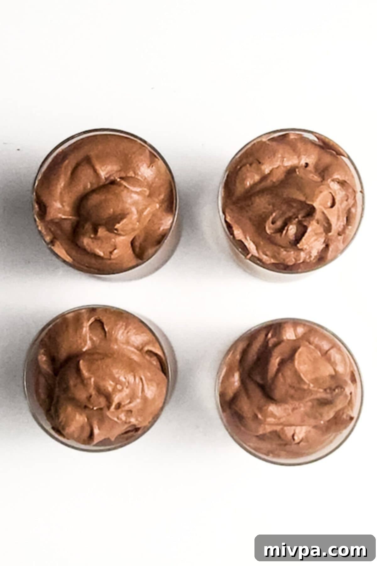 Four glasses of chocolate mousse