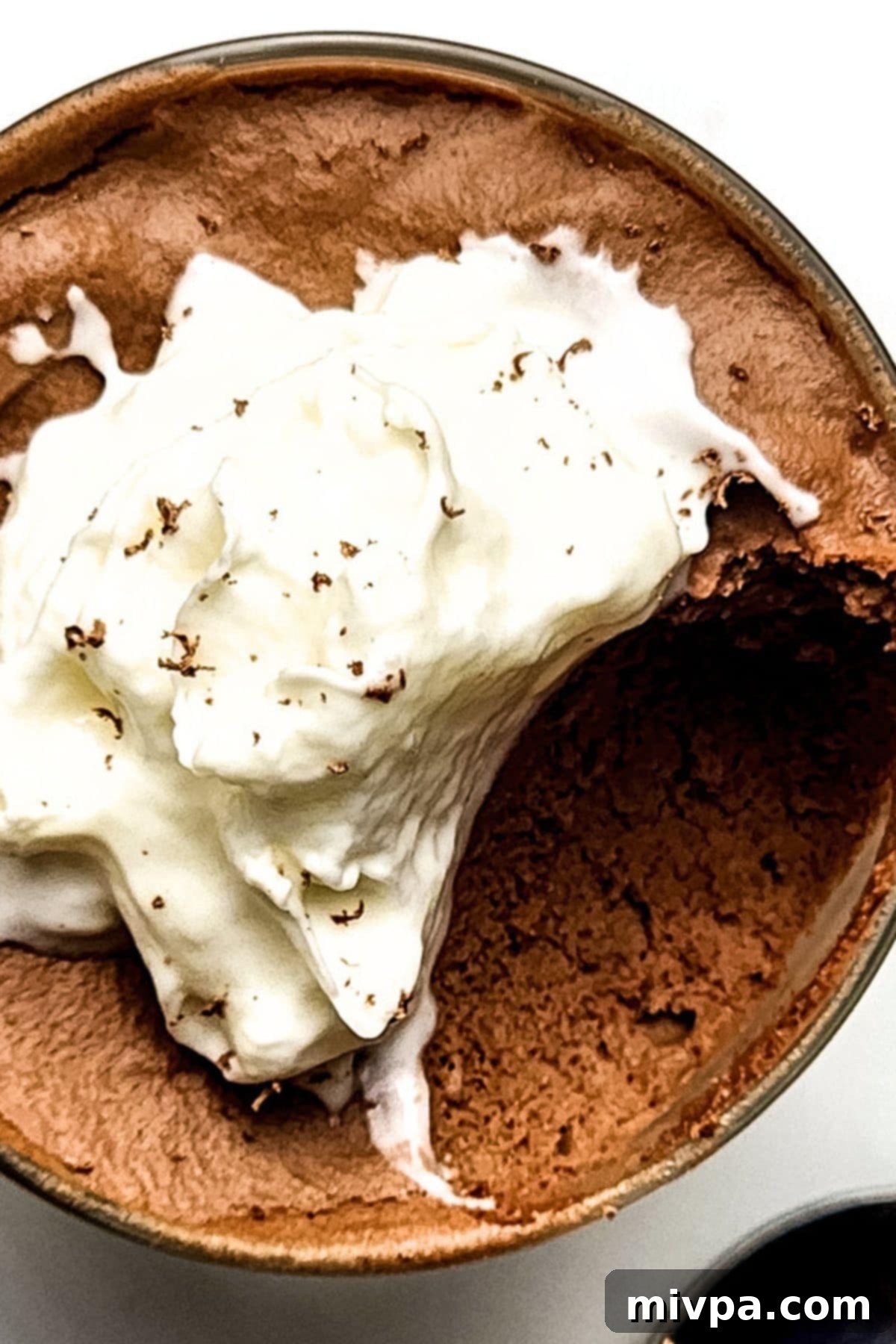 Up close view of a glass of half-eaten chocolate mousse