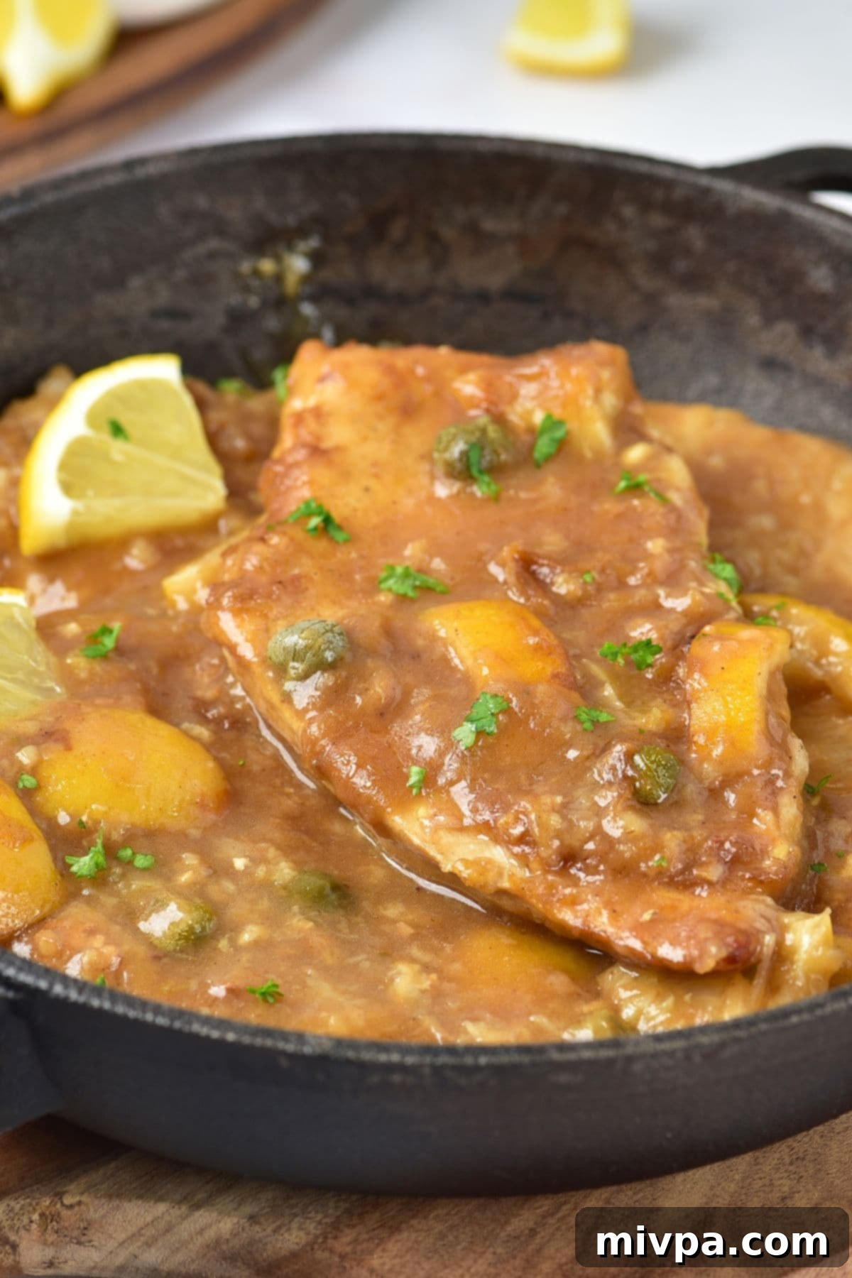 Lemon chicken piccata in cast iron skillet
