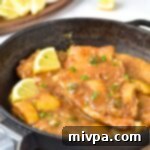 A skillet with chicken piccata