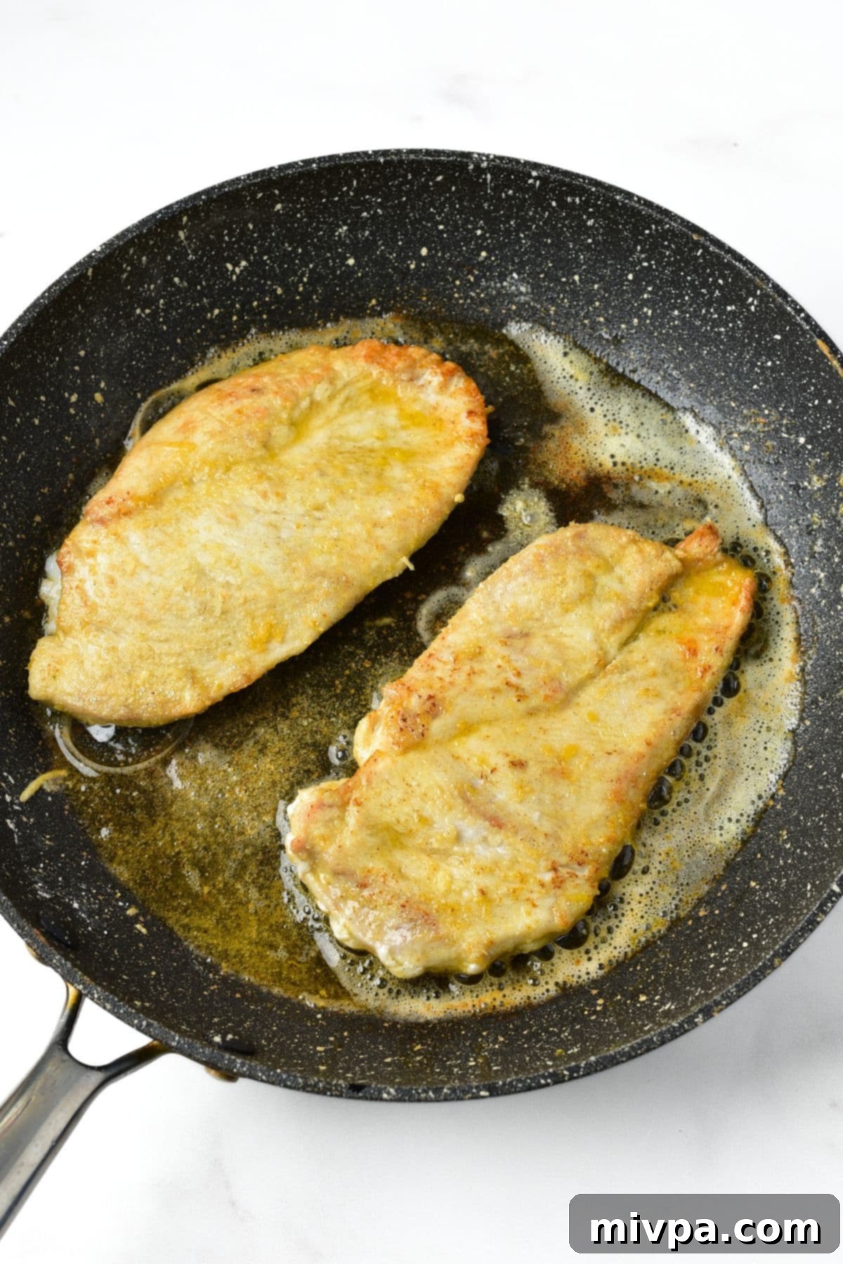 Searing chicken cutlets in skillet