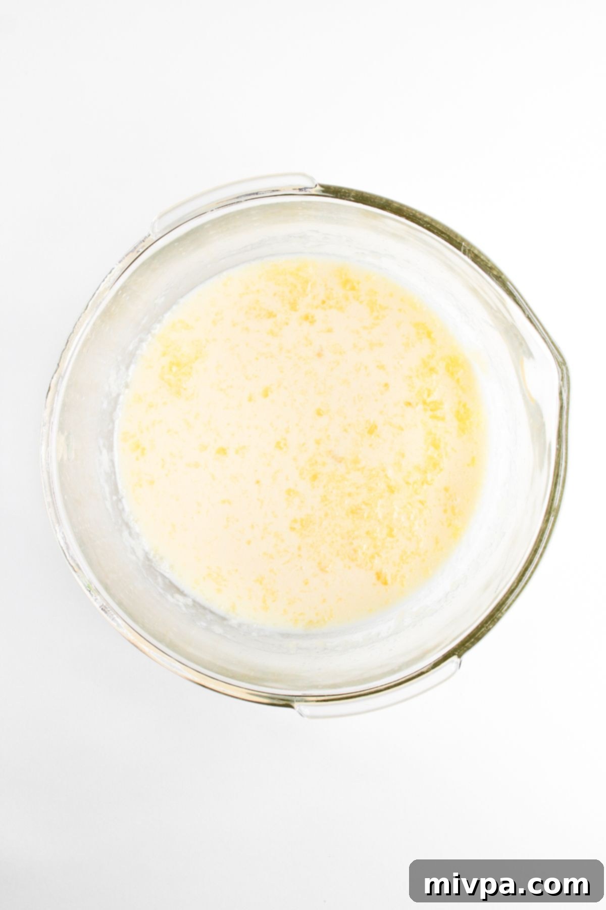 Pale yellow liquid mixture in glass bowl