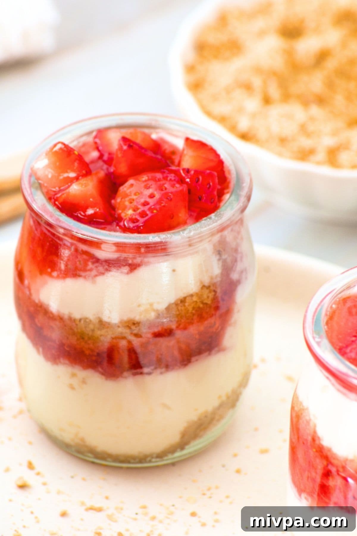 Strawberry Dessert Cups (Gluten-Free, No-Bake) Up close view of a jar of strawberry dessert cups.