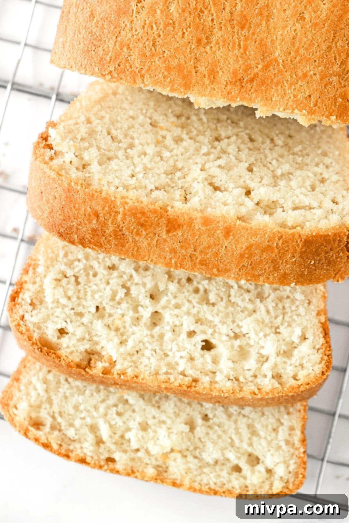 Sliced gluten and egg-free bread on wire rack