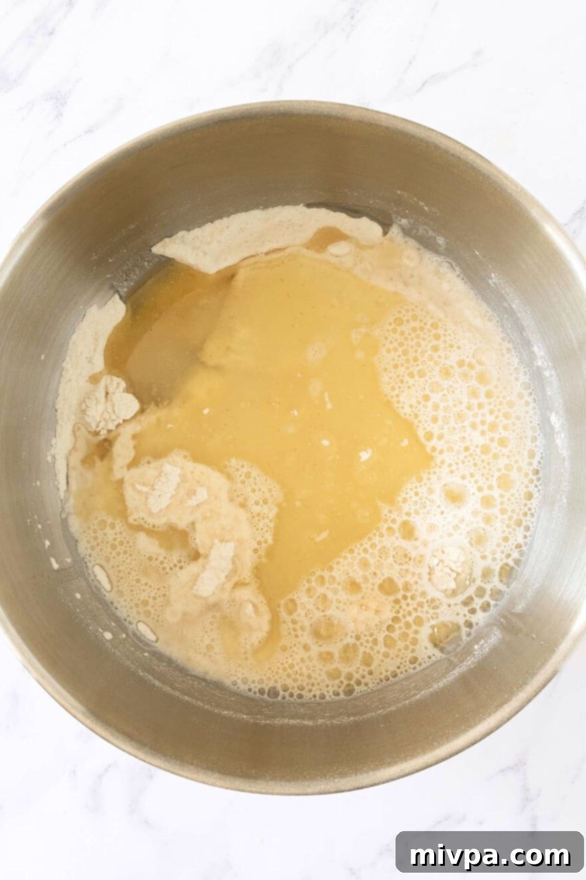 Mixing oil, water and flour mixture.