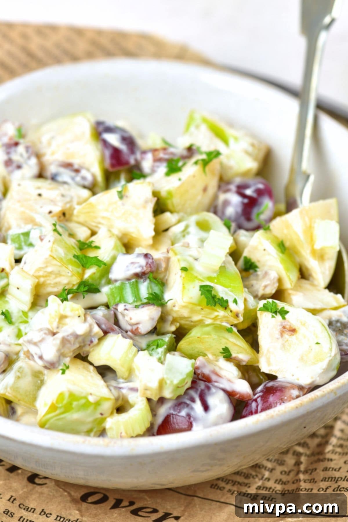 Waldorf Salad (Gluten-Free, Vegan) A bowl of salad with grapes, chicken and celery