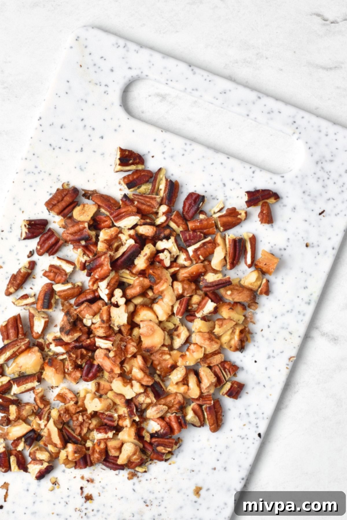 Waldorf Salad (Gluten-Free, Vegan) Chopped nuts on chopping board