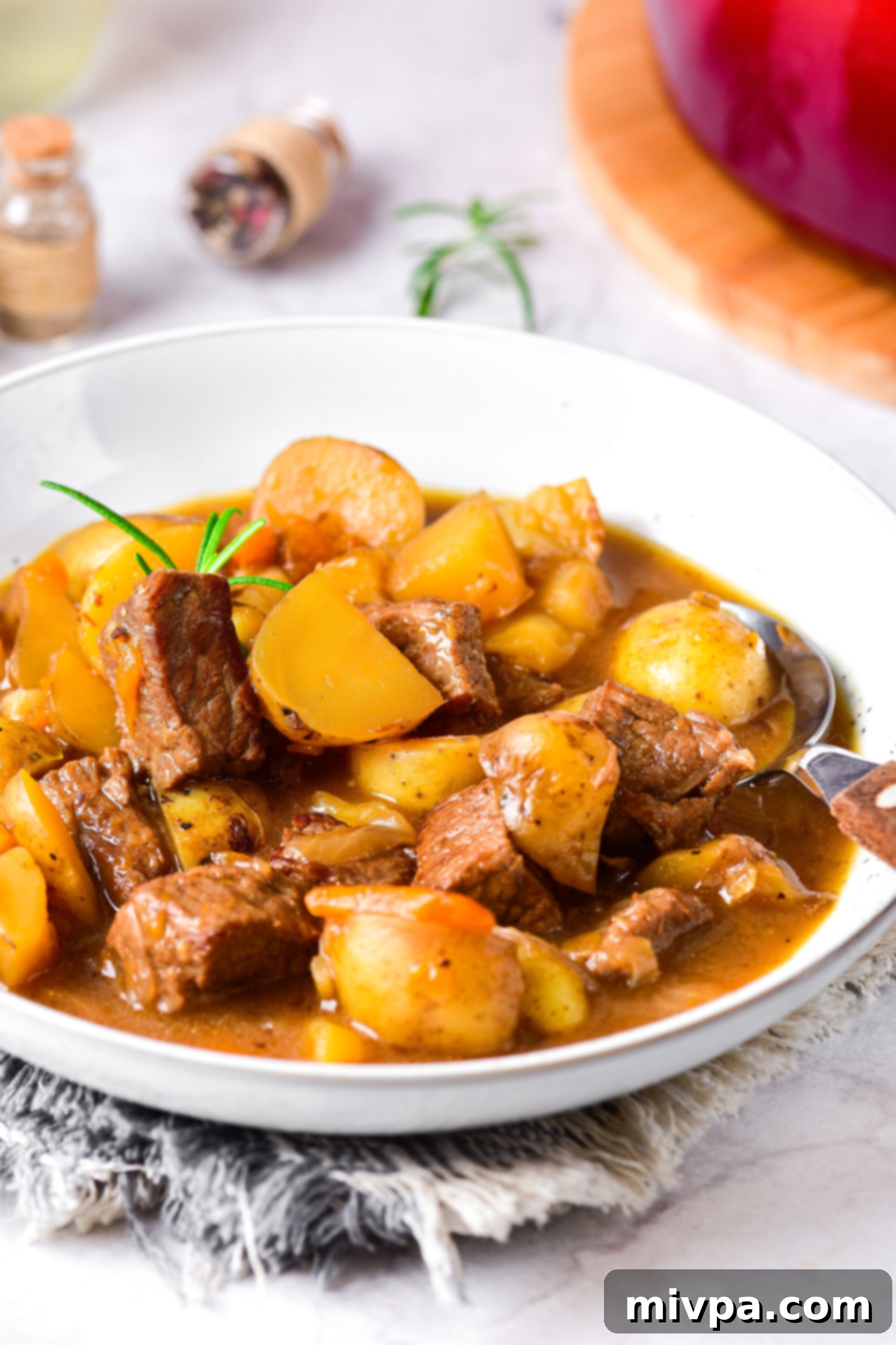 Easy Beef Stew (Gluten-Free, Dairy-Free) Tender beef stew in a white bowl.