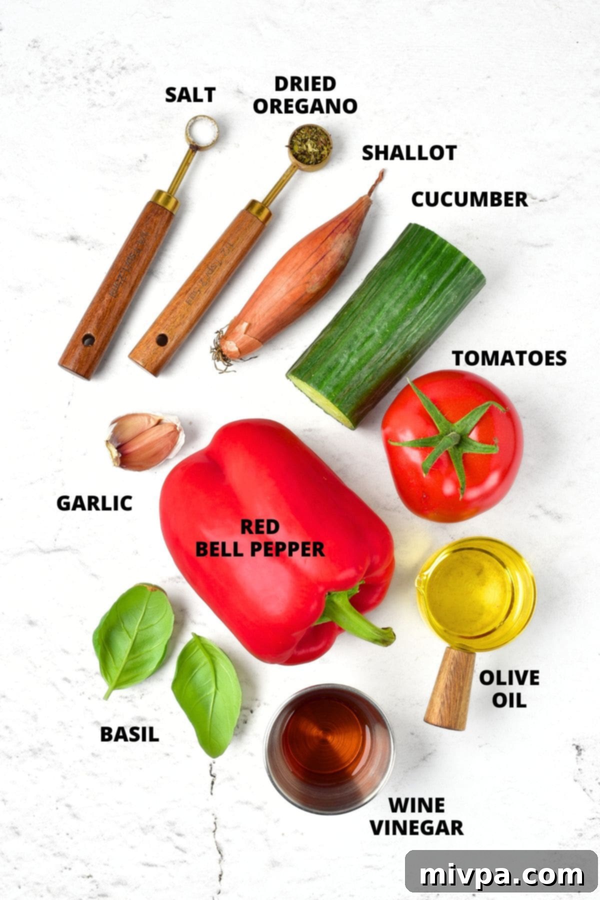 Ingredients for gluten-free gazpacho recipe laid out neatly on a marble board, showcasing fresh produce.