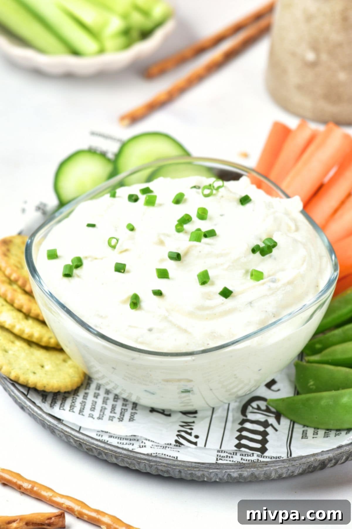 Cottage Cheese Ranch Dressing Dip Recipe A bowl of creamy ranch cottage cheese dip topped with fresh chopped chives.