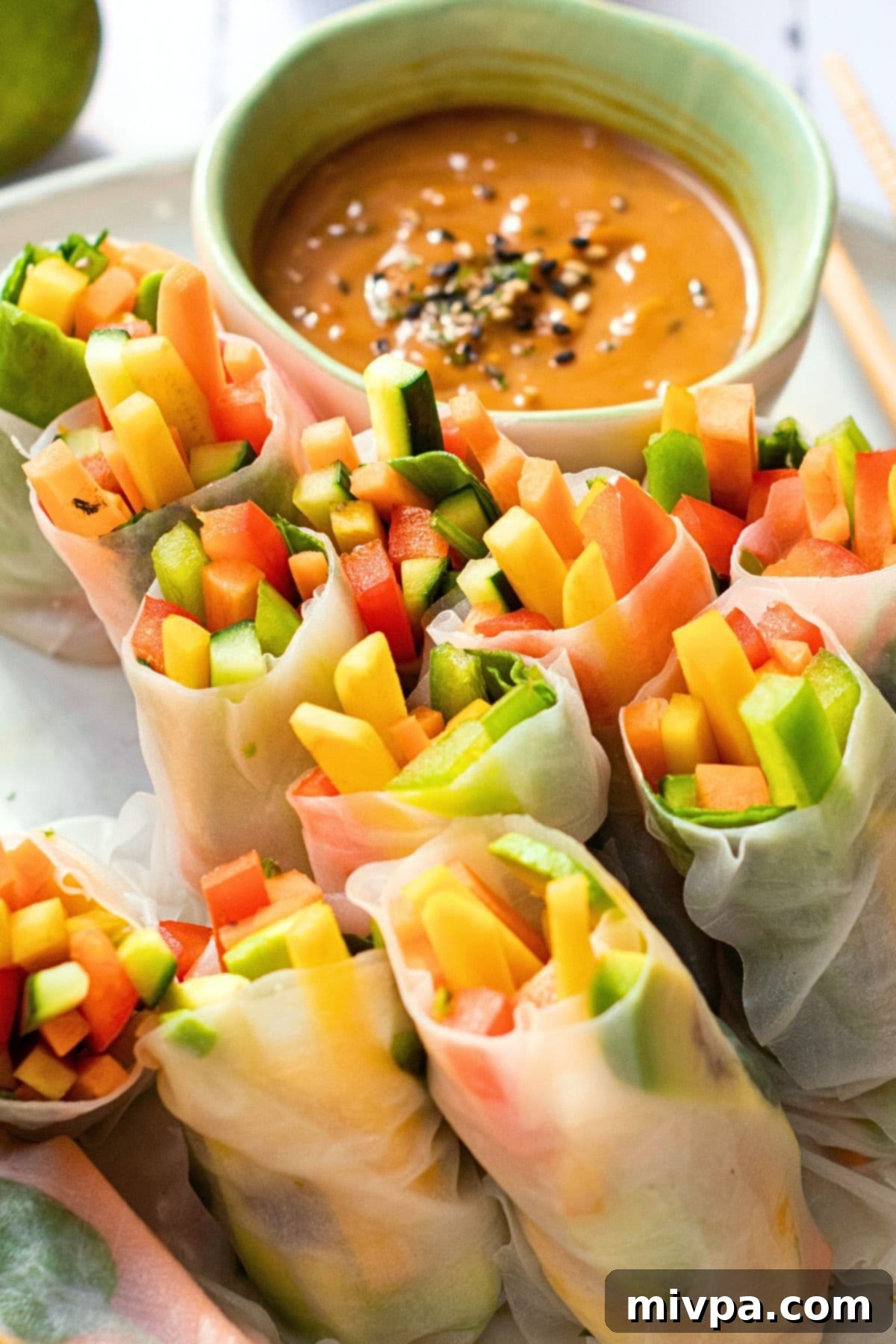 Colorful fresh summer rolls on plate.