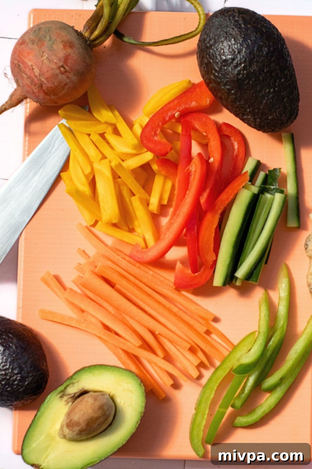 Sliced veggies on chopping board.