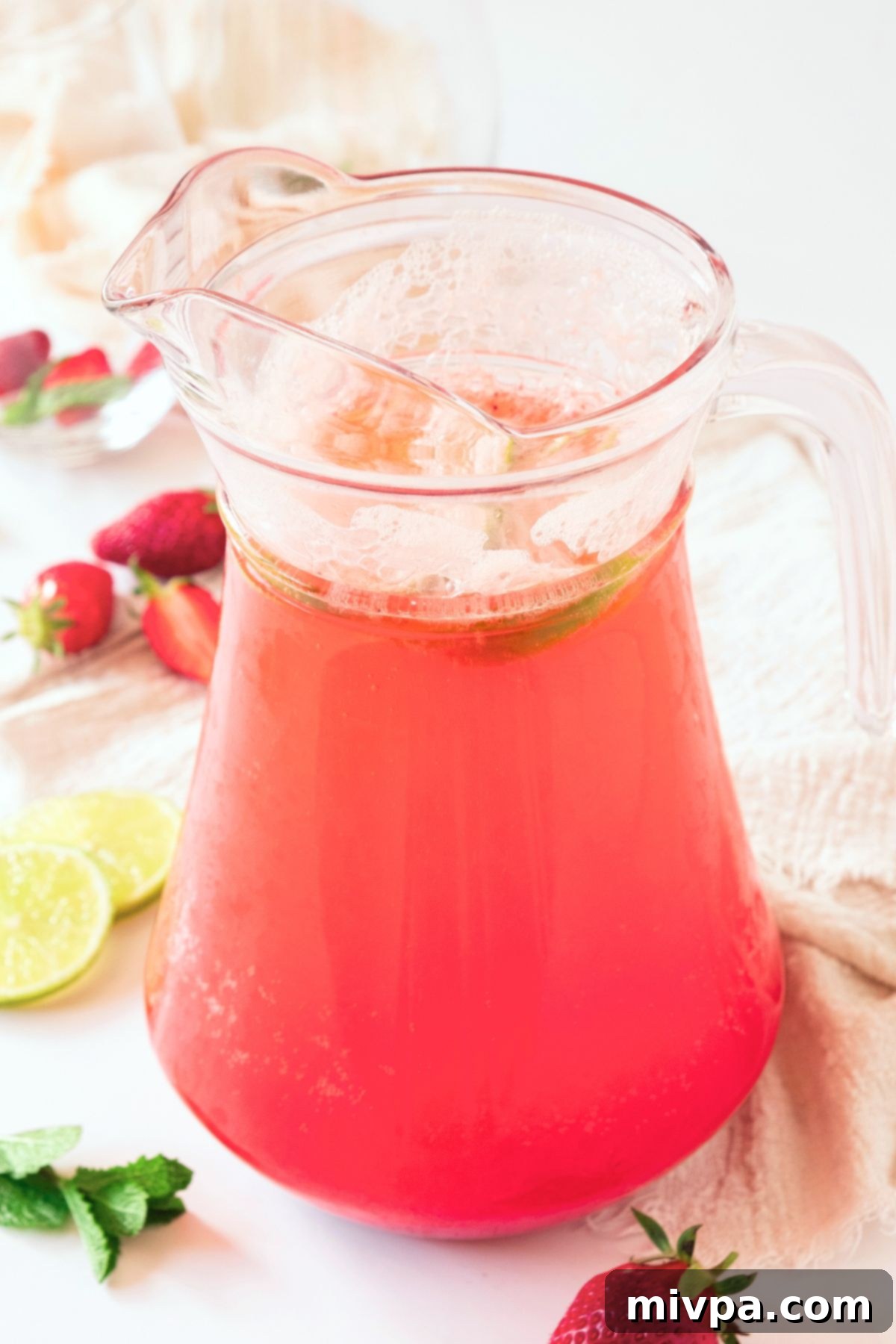 Strawberry Sparkling Lemonade A pitcher of strawberry sparkling lemonade.