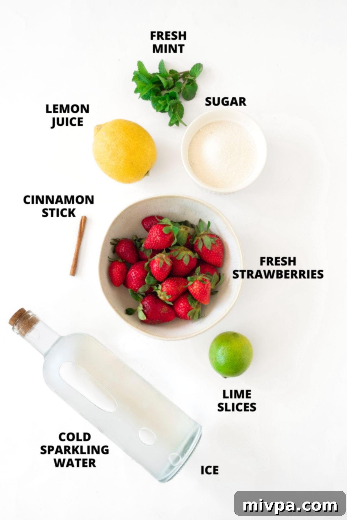 Sparkling Strawberry Lemonade Recipe (Gluten-Free, Vegan) Ingredients for sparkling strawberry lemonade recipe laid out on white board.