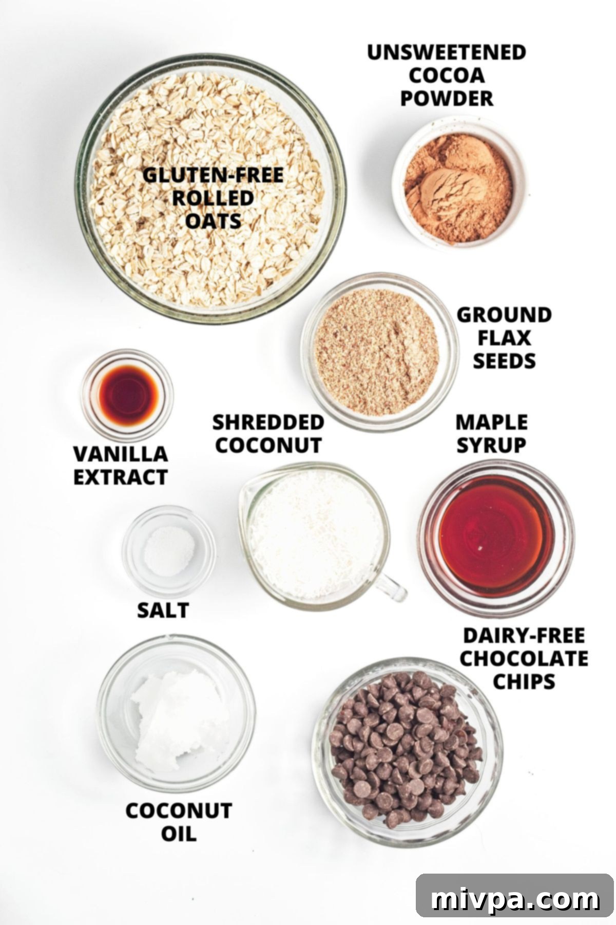 Chocolate Coconut Granola Recipe (Gluten-Free, Vegan) Ingredients for chocolate coconut granola recipe laid out on white board.