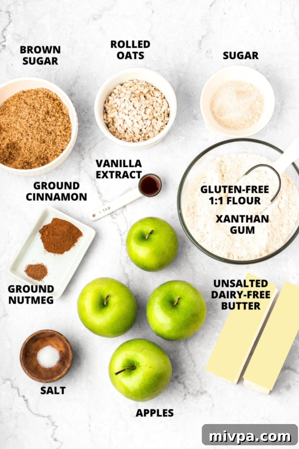 Gluten-Free Apple Pie Bars Recipe (Vegan) Ingredients for gluten-free apple pie bars recipe laid out on marble board, ready for prep.