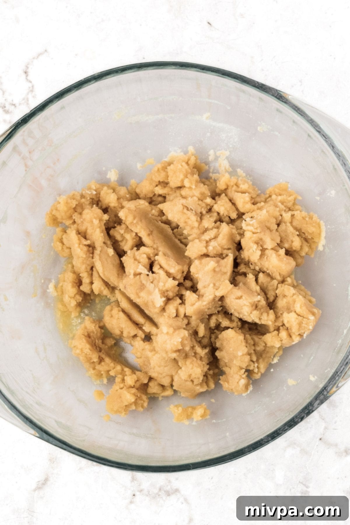 How to Make Apple Pie Bars A bowl of freshly mixed pie crust dough.