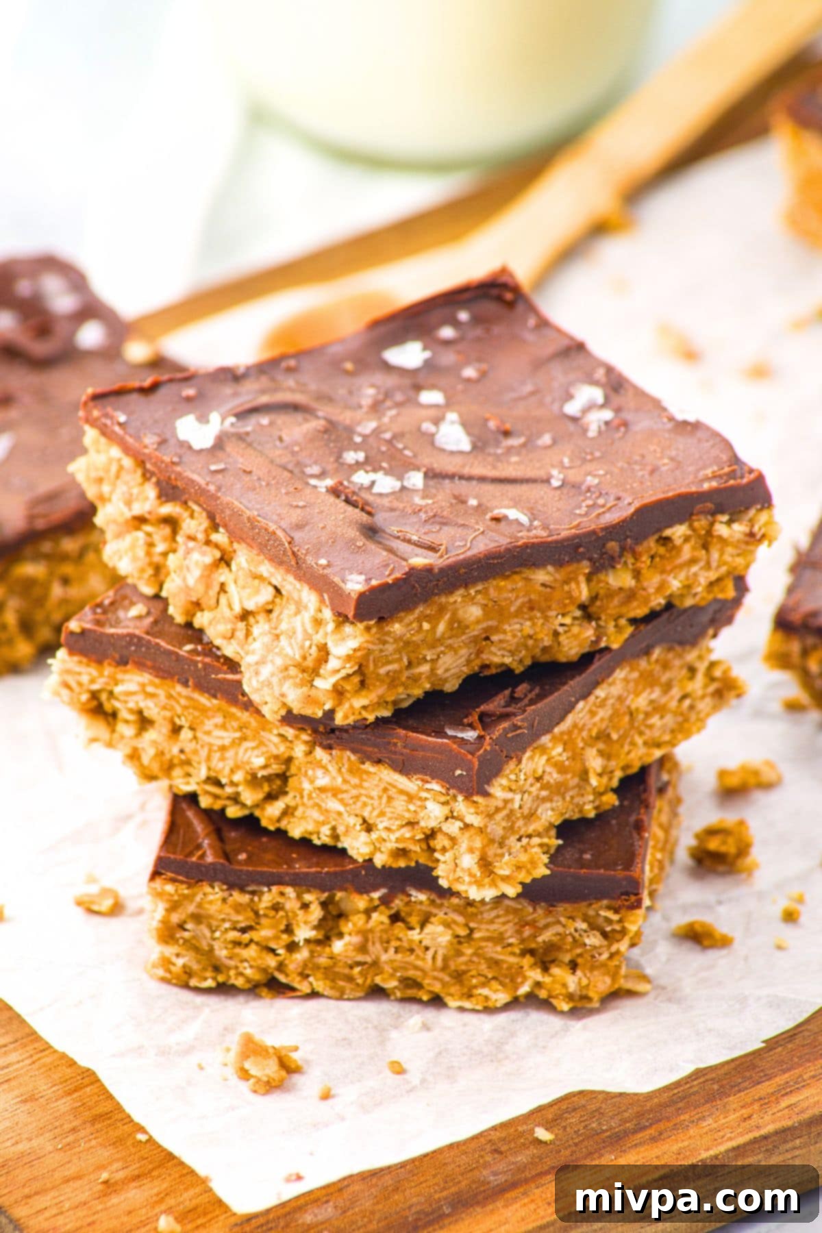 No-Bake Peanut Butter Oatmeal Bars (Gluten-Free, Vegan) A vibrant stack of no-bake peanut butter oatmeal bars, ready to be enjoyed.