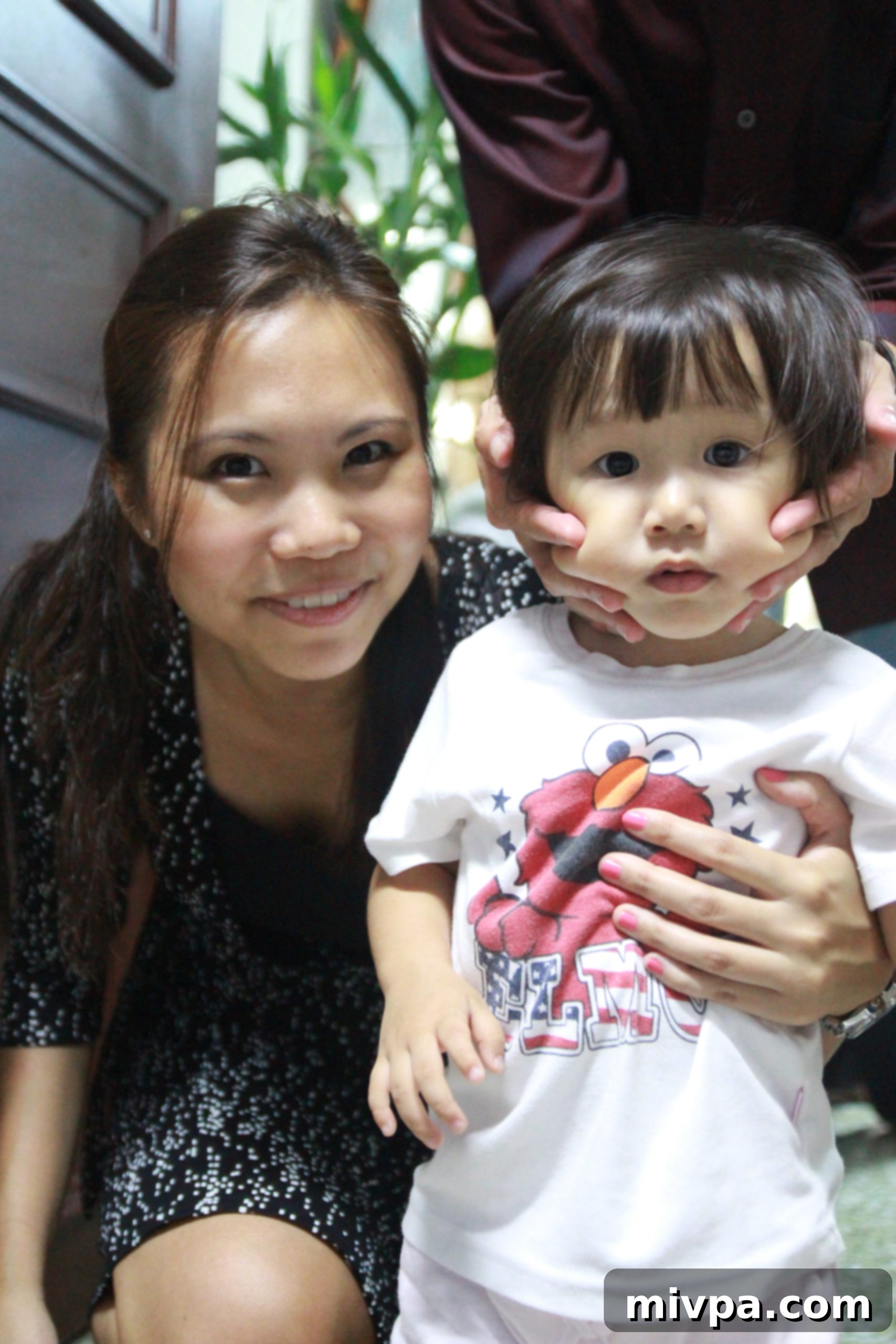Cousin En Tong playing with family members