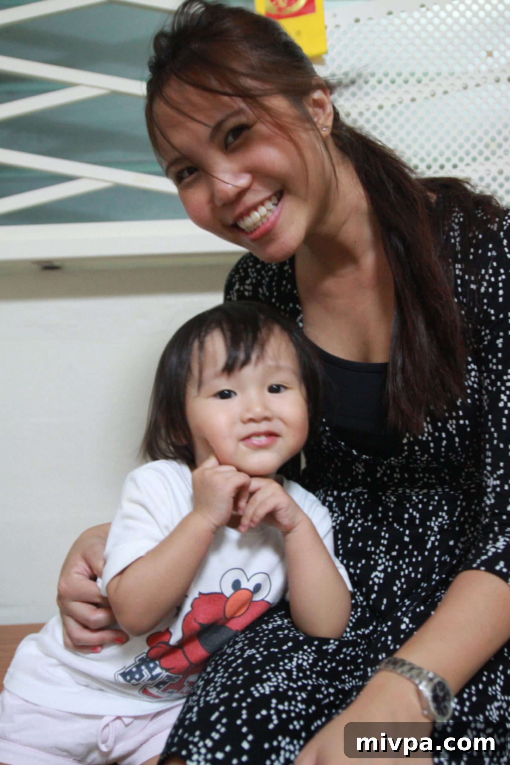 Smiling En Tong enjoying family time