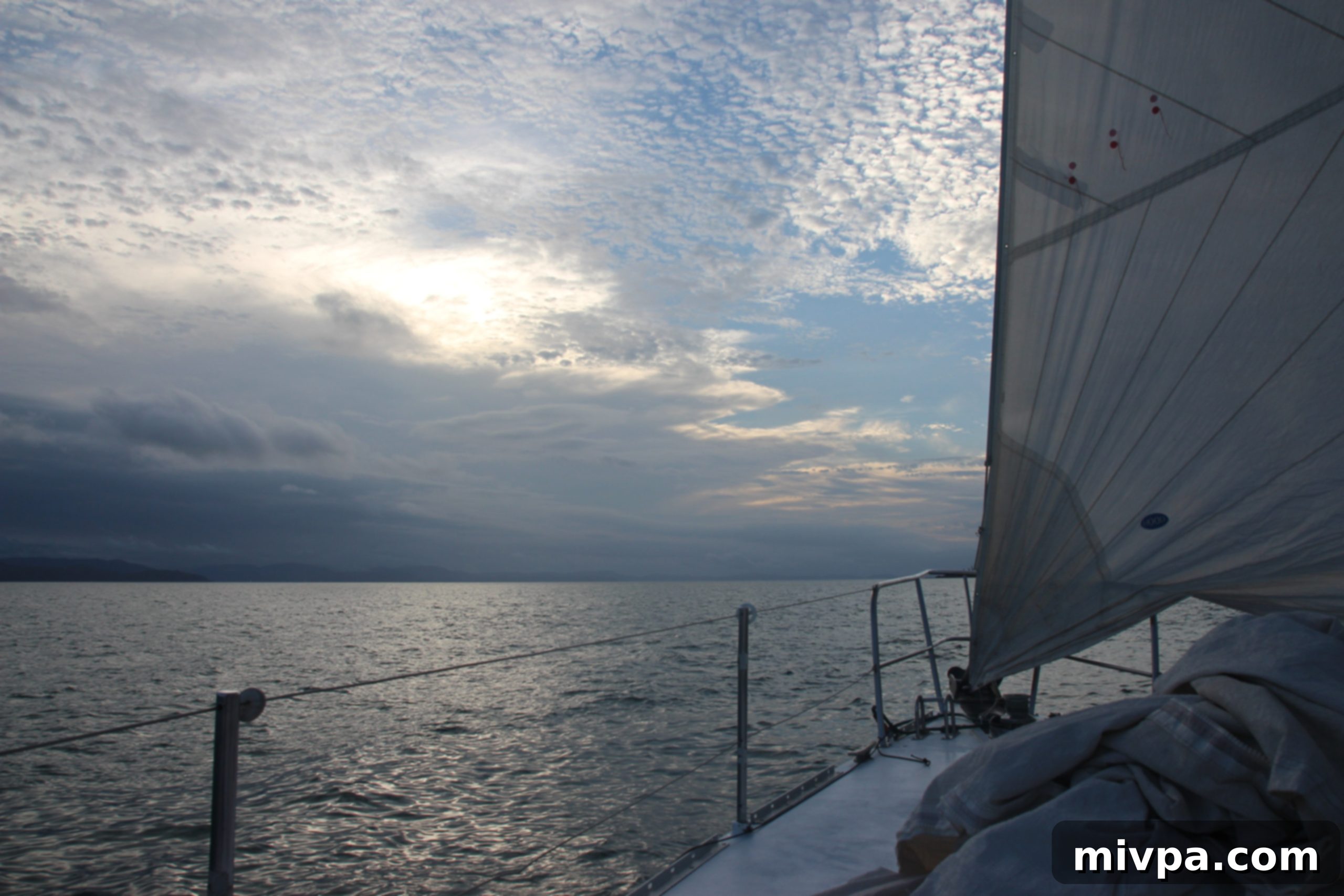 Couple enjoying a quiet moment together on the deck of a sailboat in the Whitsundays