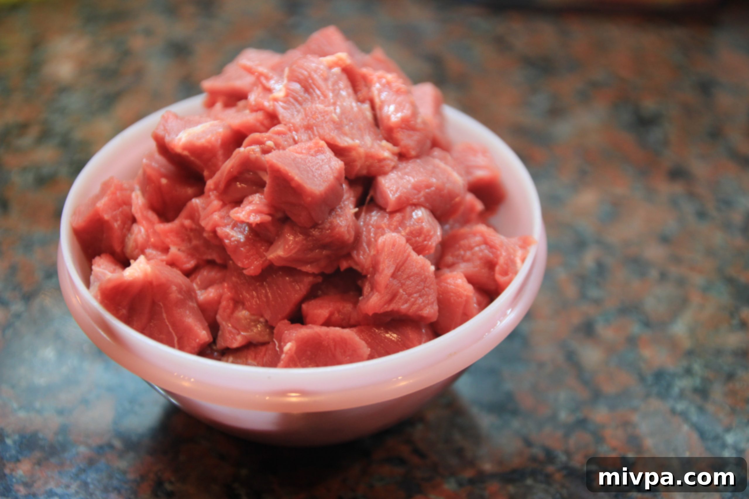 Cutting rump steak into cubes