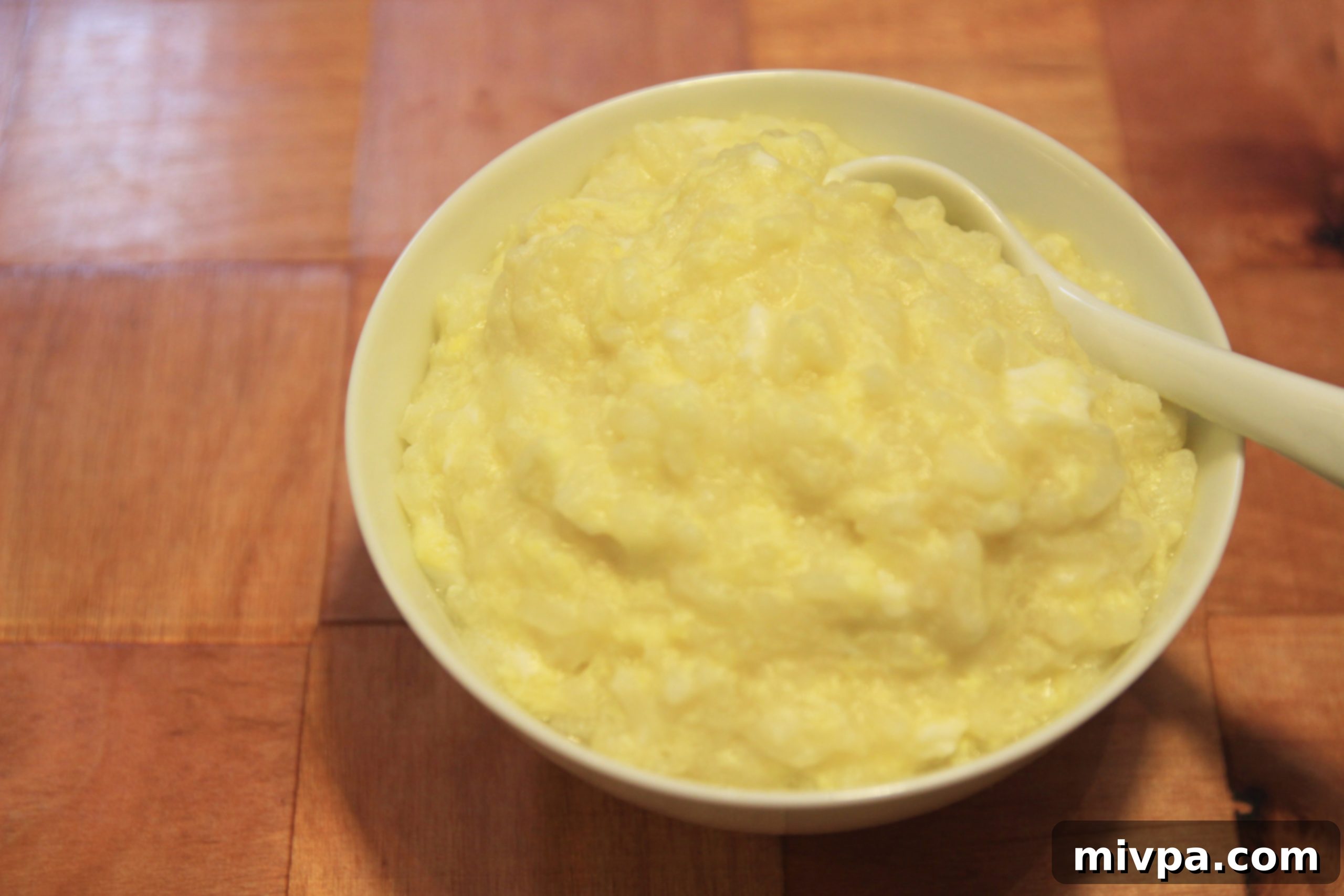 A bowl of freshly cooked egg porridge, ready to be served.