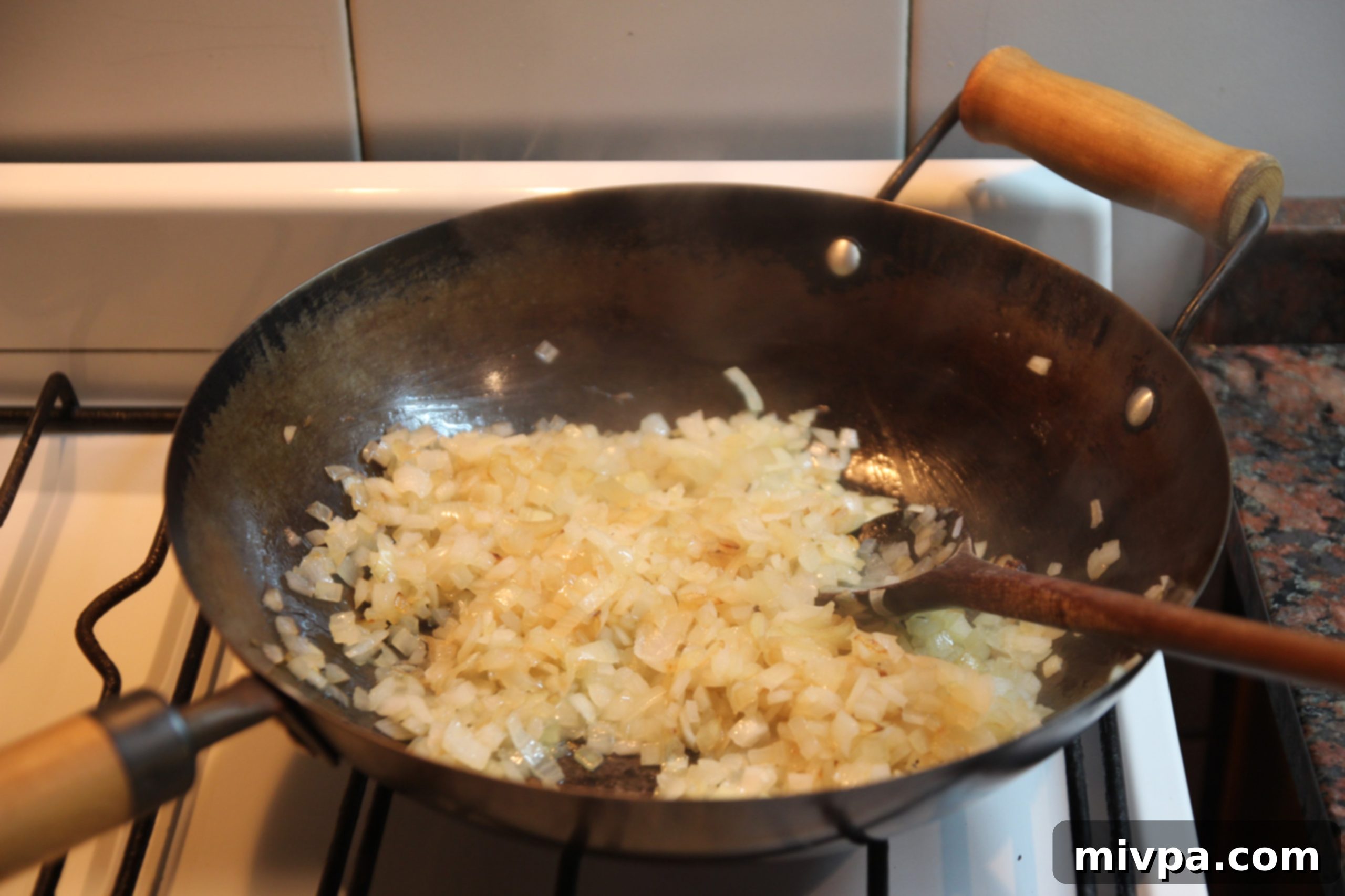 Caramelized onions in the wok, golden brown and fragrant