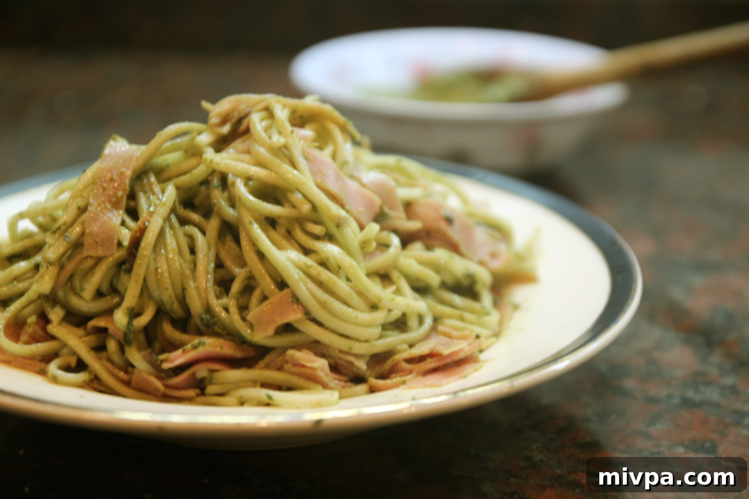 Close-up of Basil Walnut Pesto & Ham Spaghetti, ready to be served