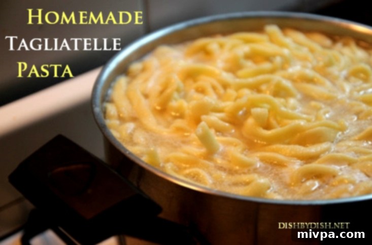 Boiling fresh tagliatelle pasta in a pot of water.