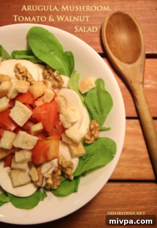 Arugula, Mushroom, Tomato & Walnut Salad showcasing vibrant greens and fresh ingredients