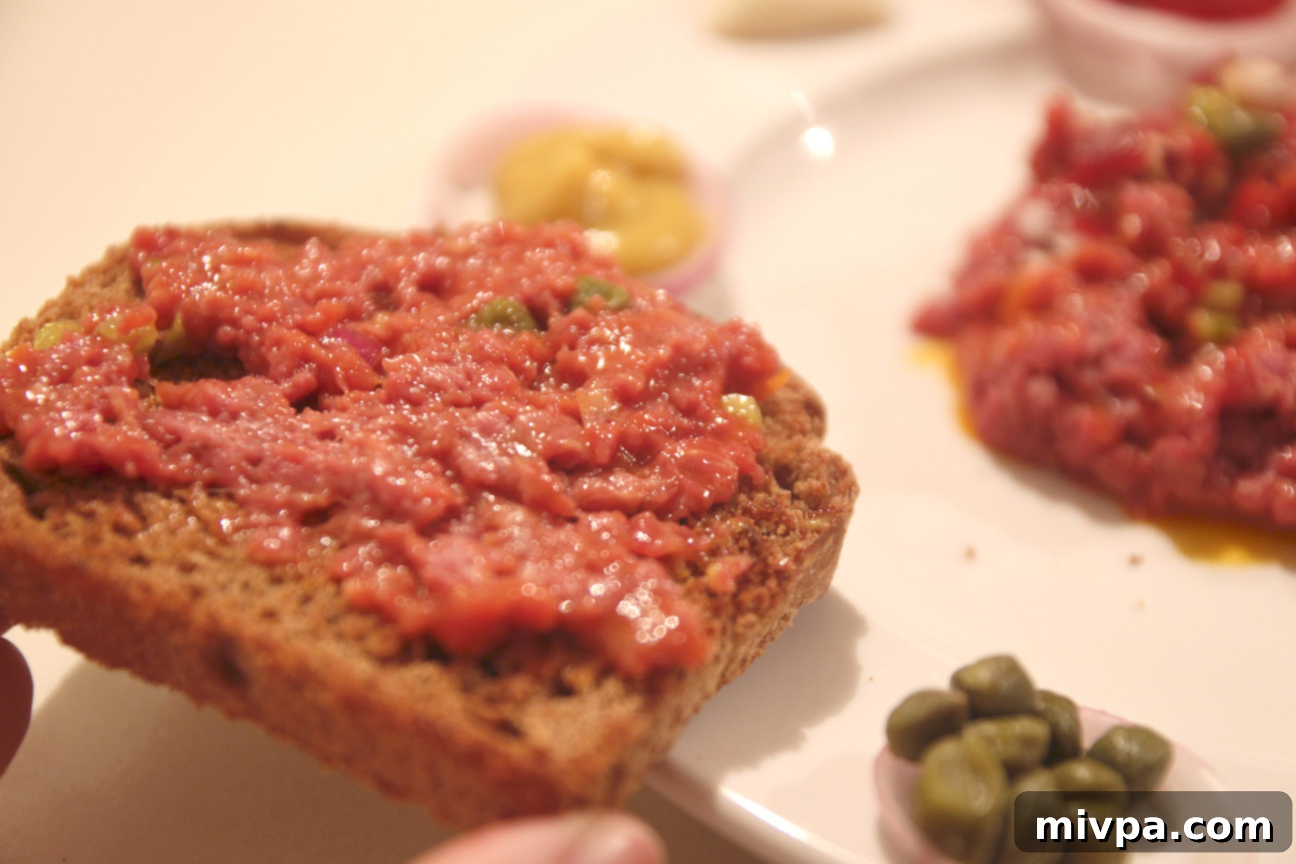 Final plated Steak Tartare on toast, ready to be enjoyed