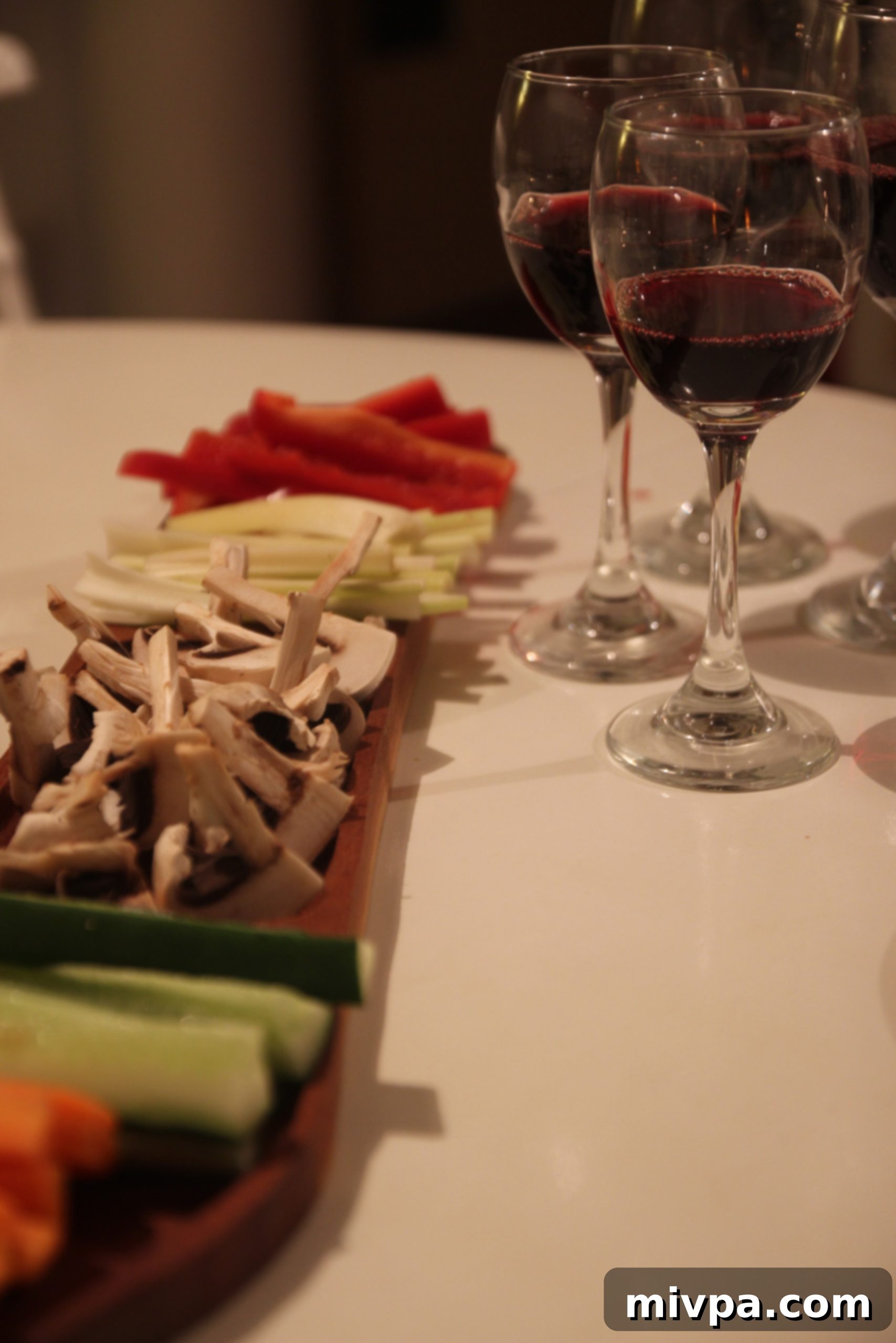 Elegant table setting with wine glasses and an appetizer