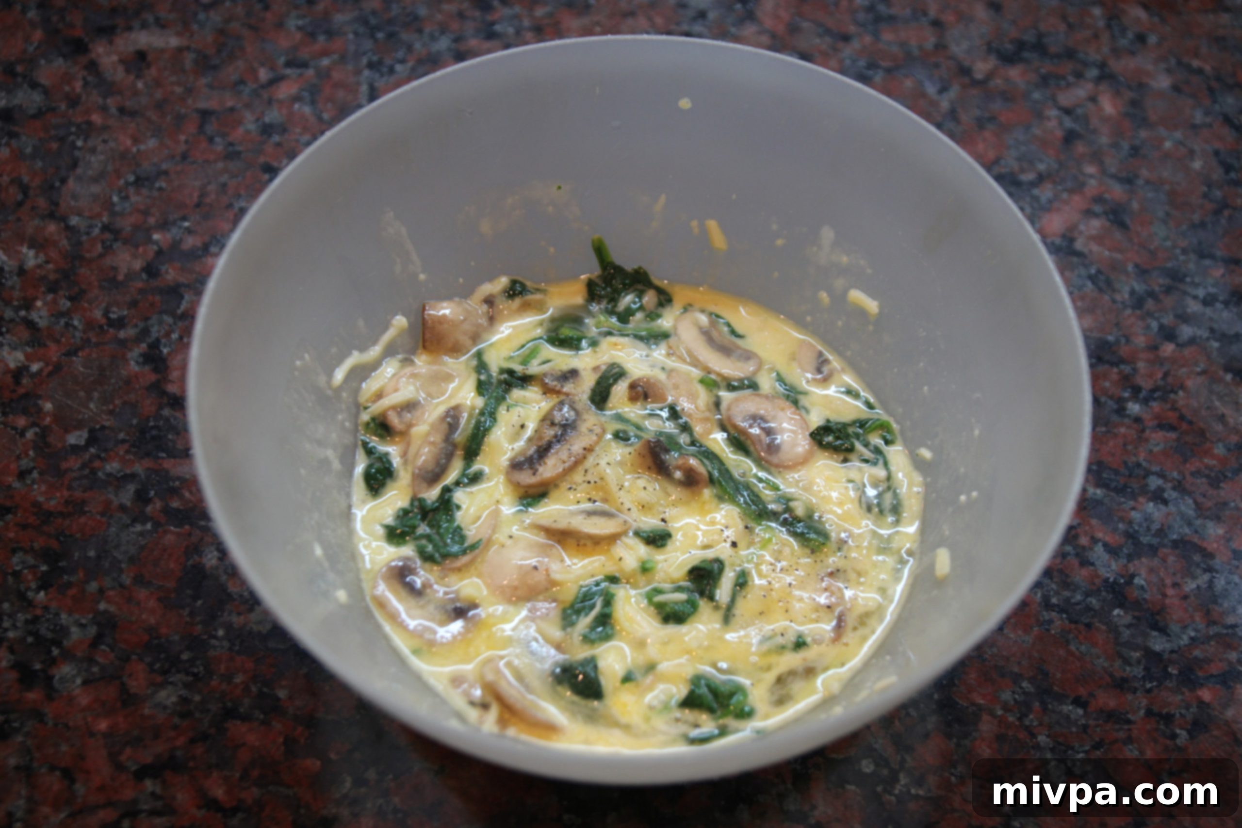 Homogeneous quiche mixture in a bowl