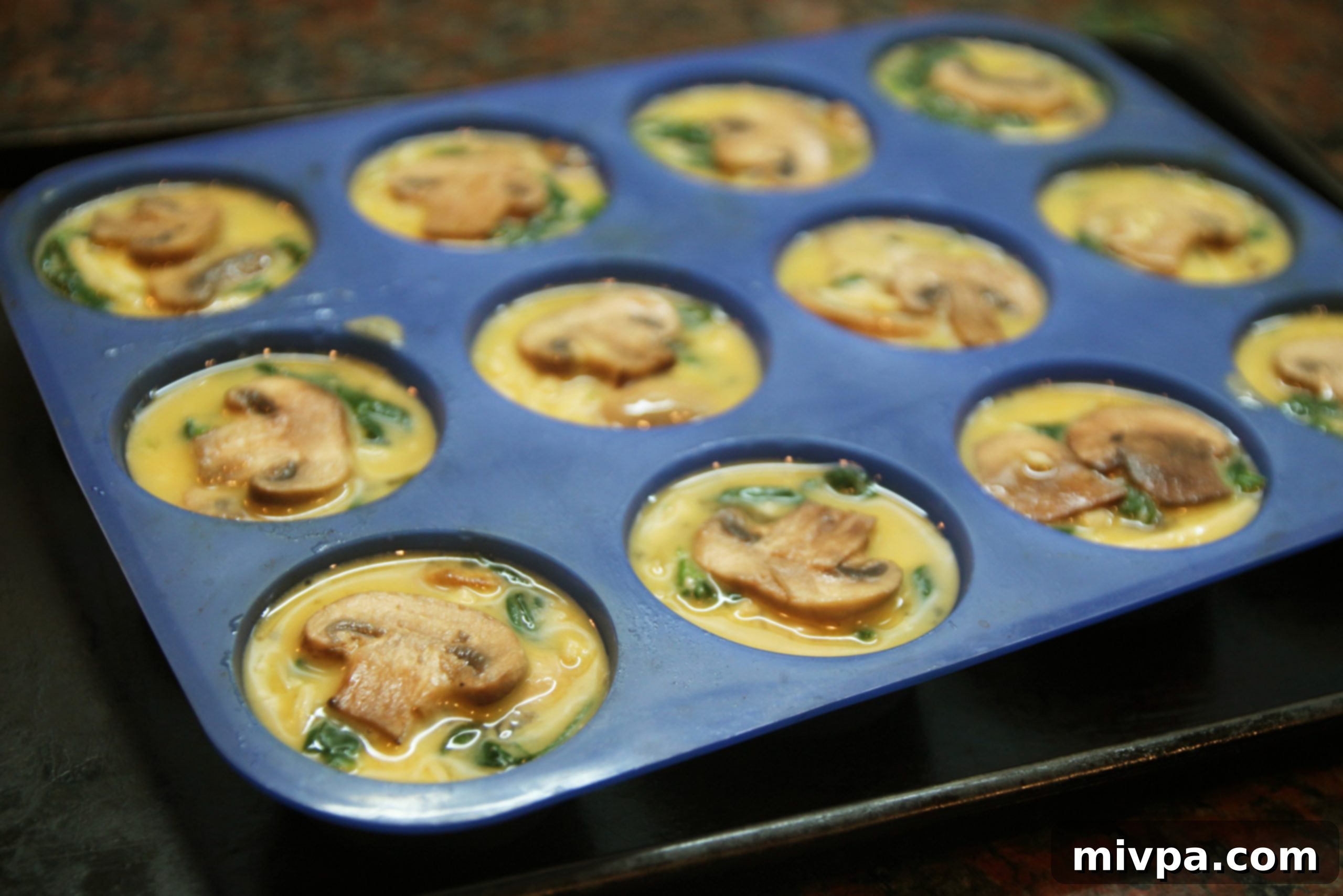 Filling muffin molds with quiche mixture