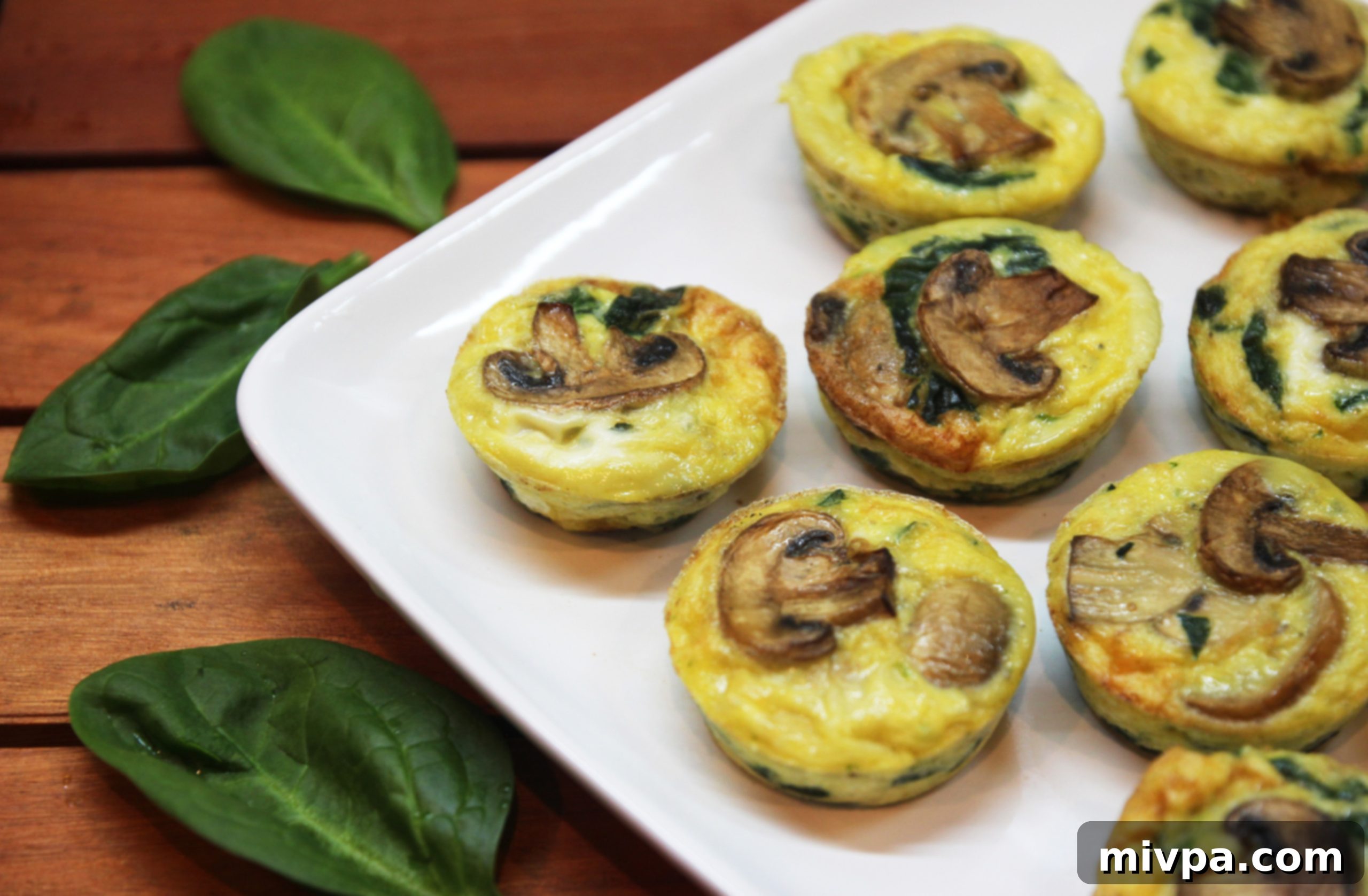 Baked Mushroom Spinach Quiche Cups in a muffin tin
