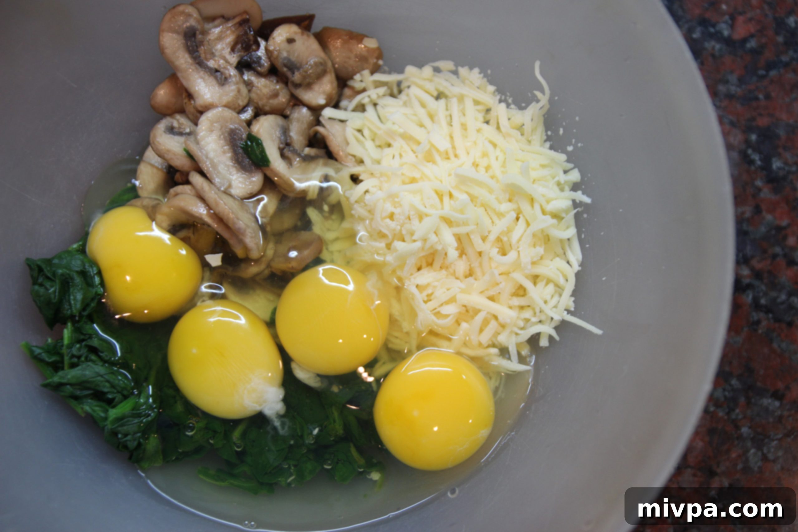 Mixing quiche ingredients in a bowl