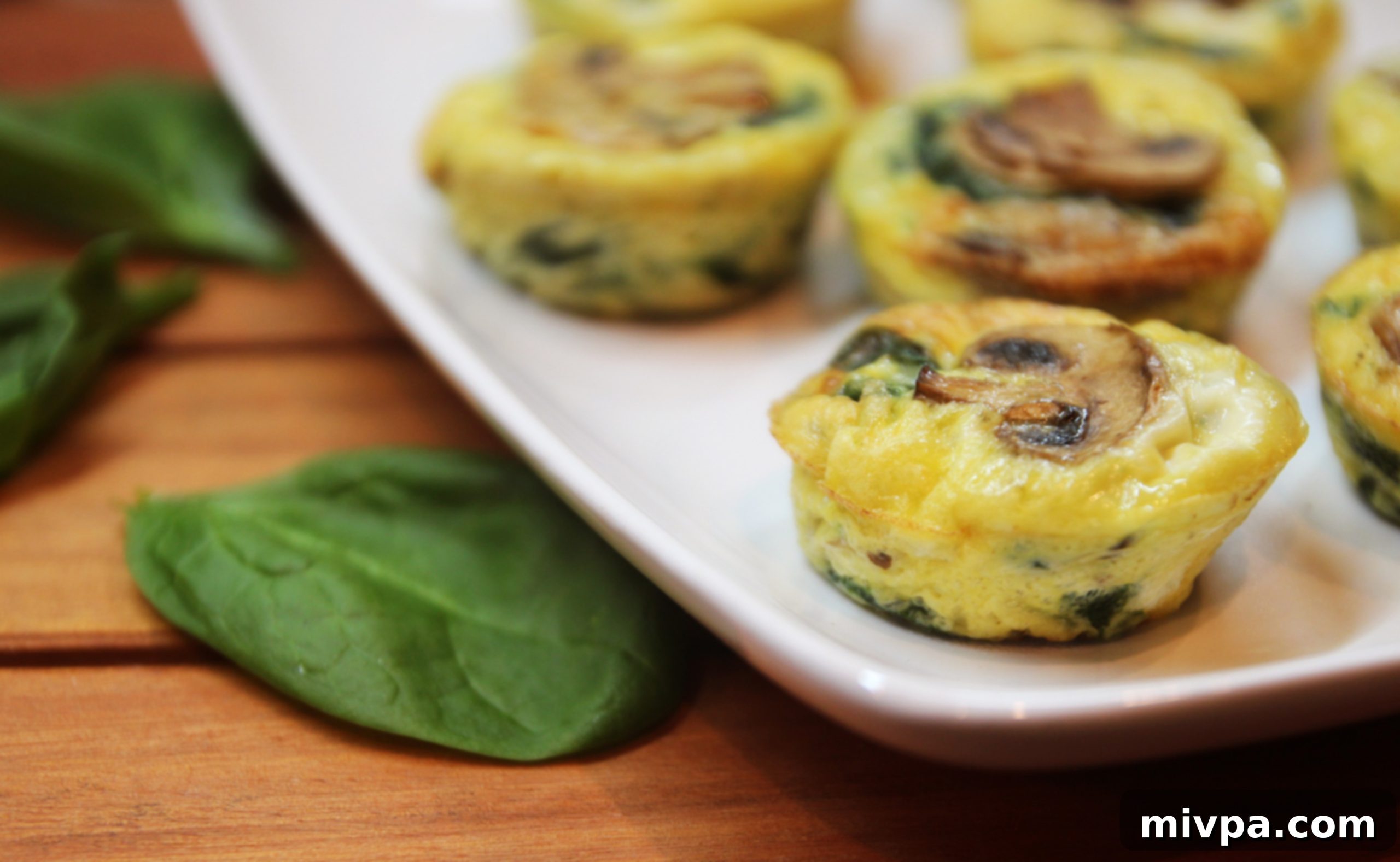 Side view of a Mushroom Spinach Quiche Cup, showing layers